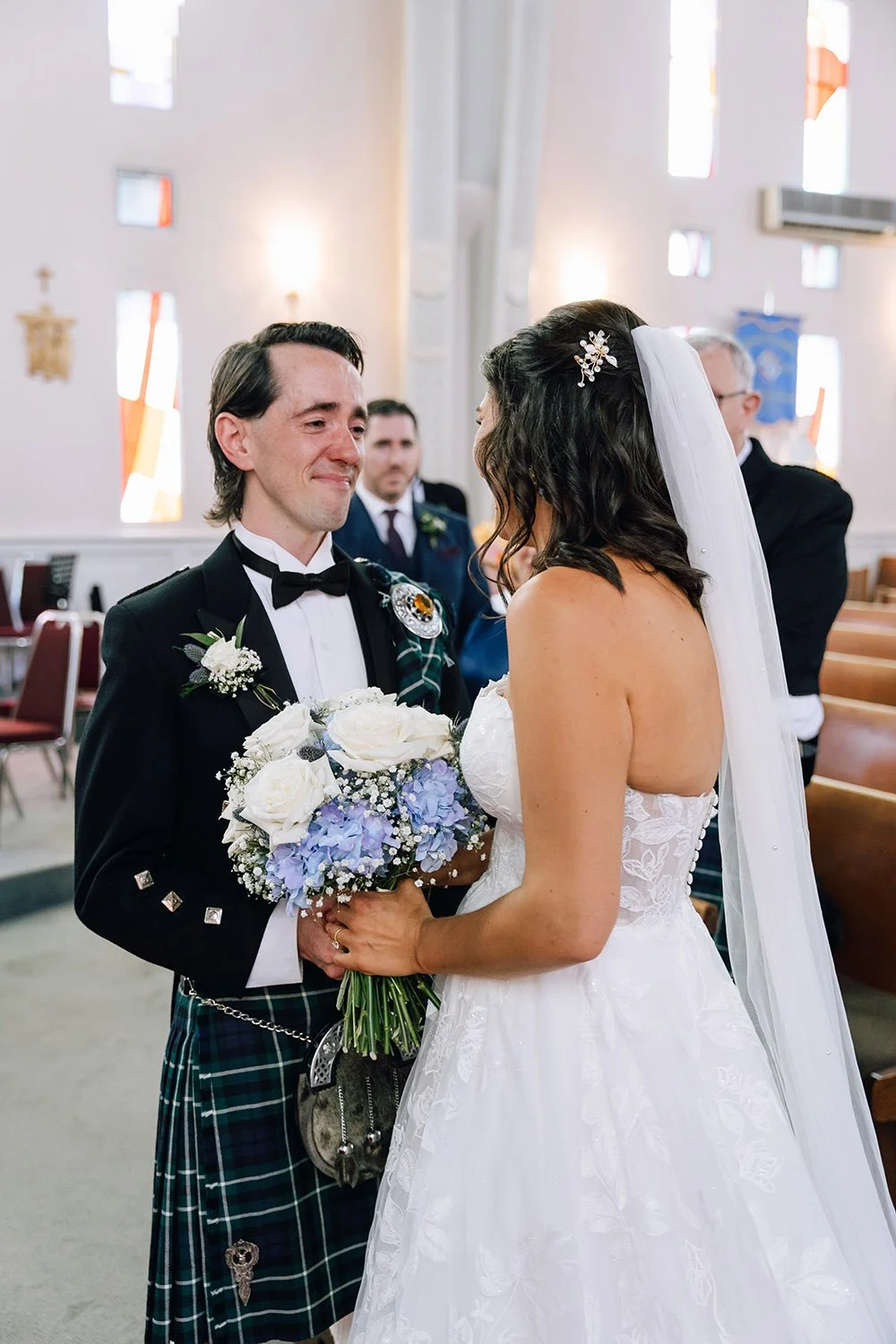 Emotional groom greeting his bride during their wedding ceremony in Ontario