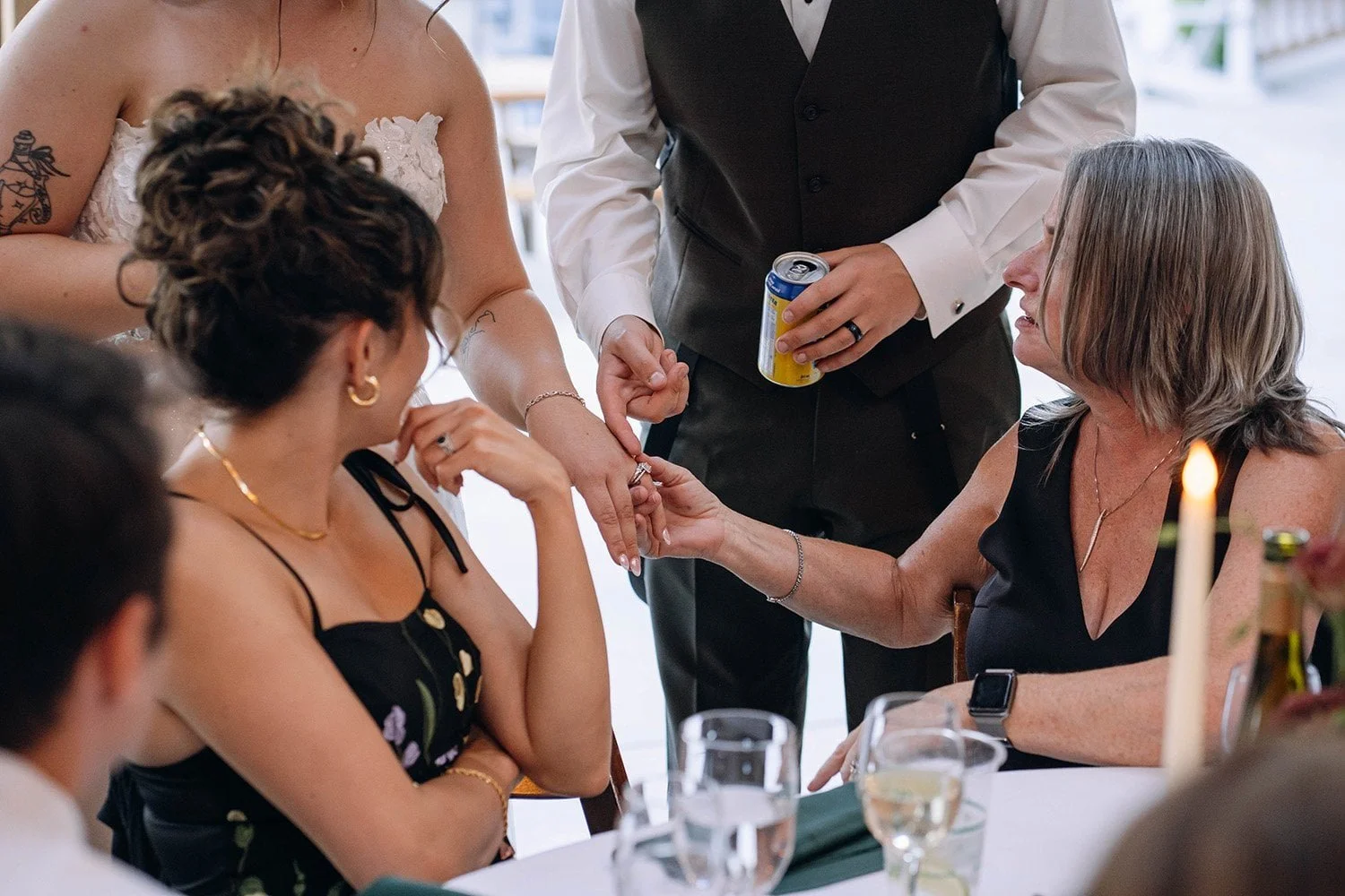 Bride and groom showing their wedding rings to guests during an Ontario wedding celebration