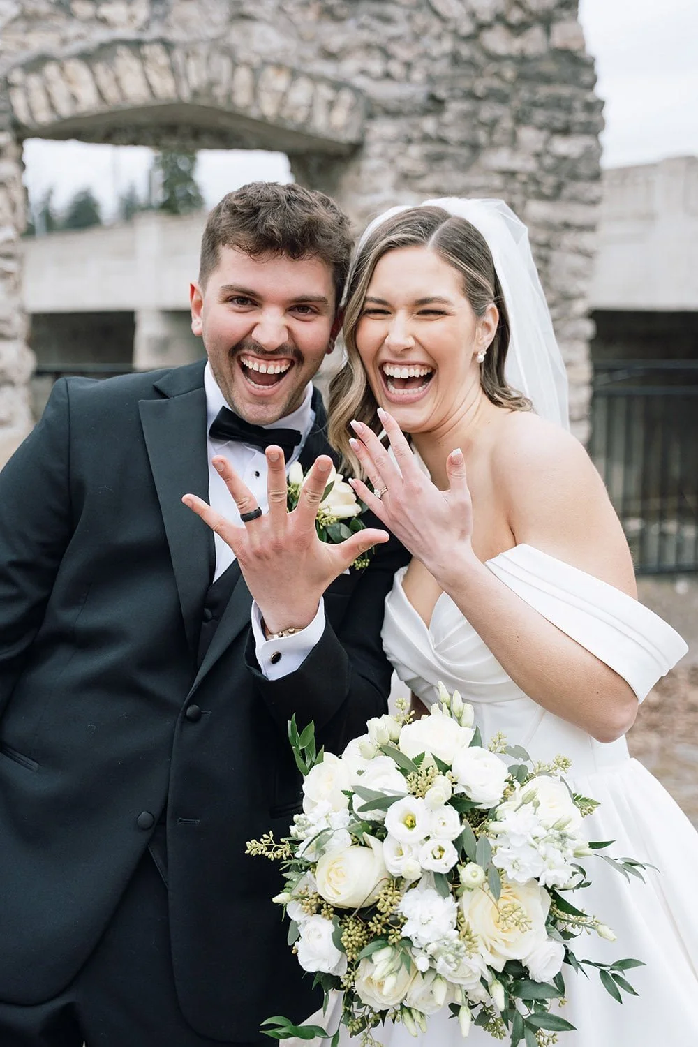 Newlywed couple showing off their wedding rings during documentary-style Ontario wedding photography