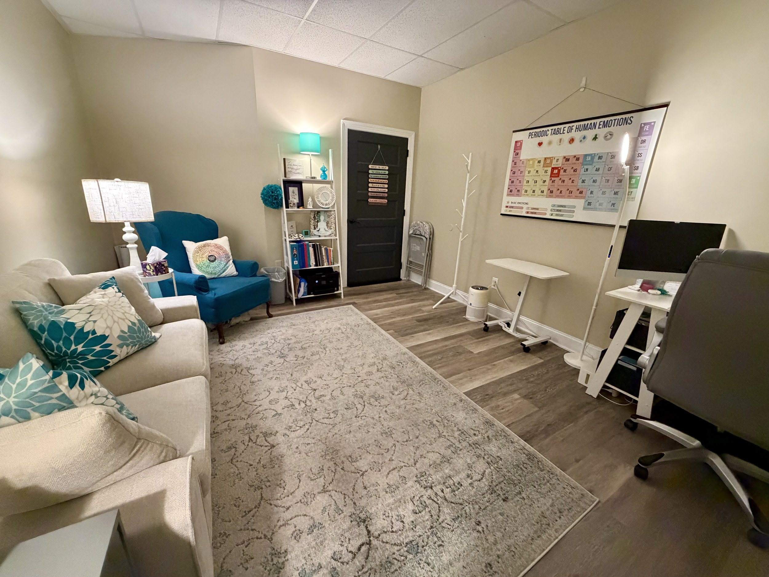 warm mental health therapy office using blues and teals