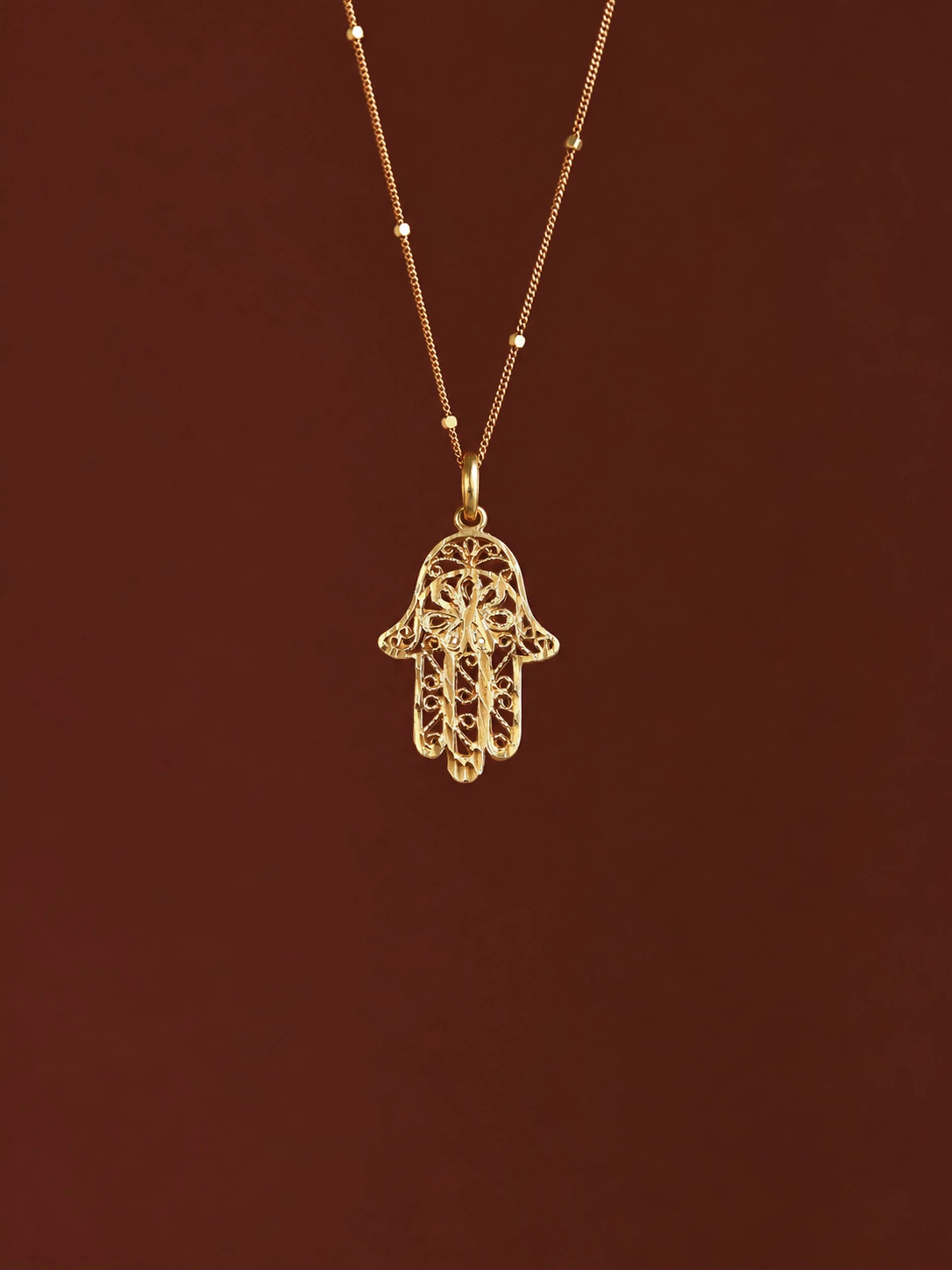 9k Gold Hamsa Hand.jpg