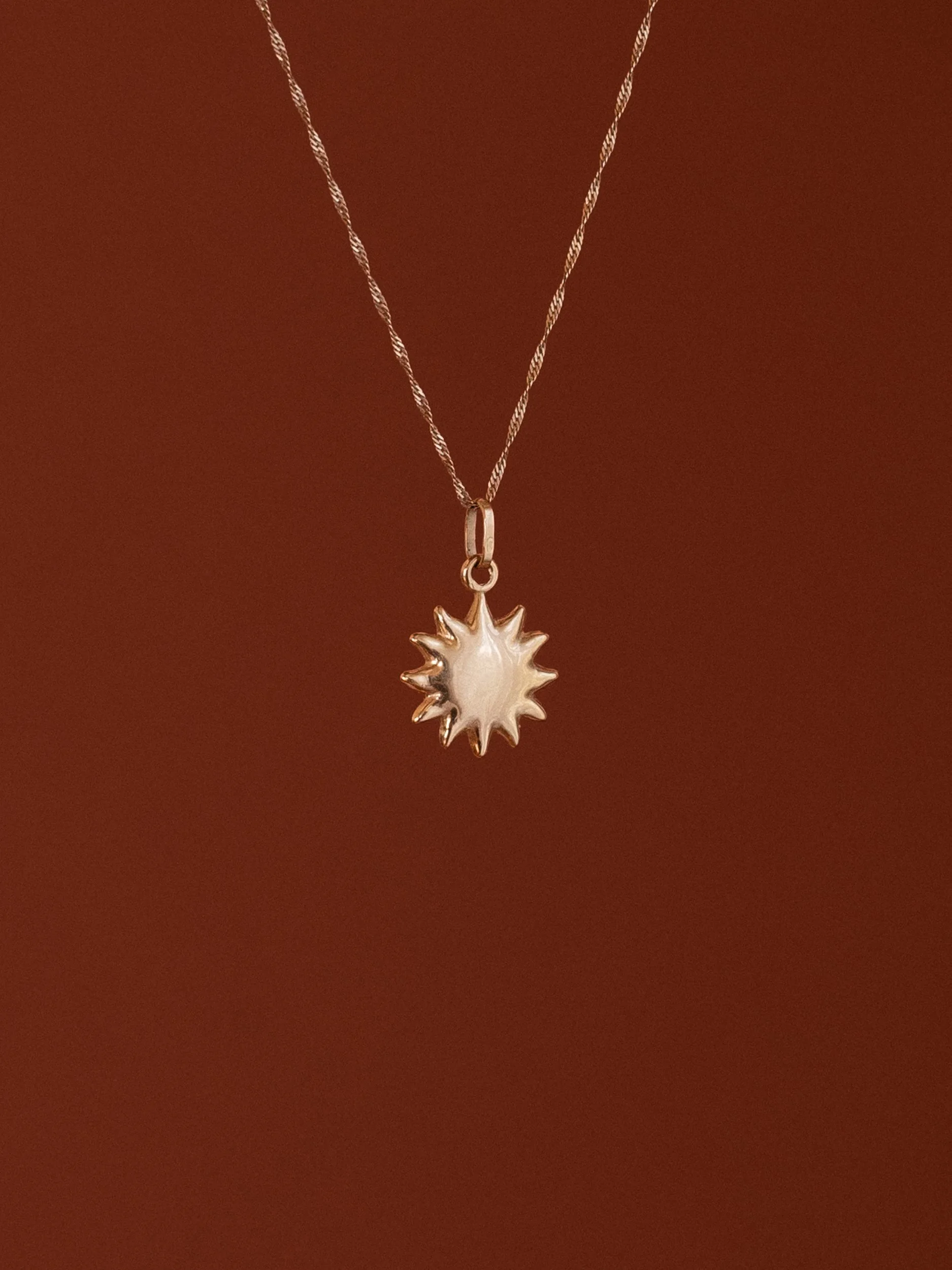 14k Gold Geometric Sun Charm.jpg