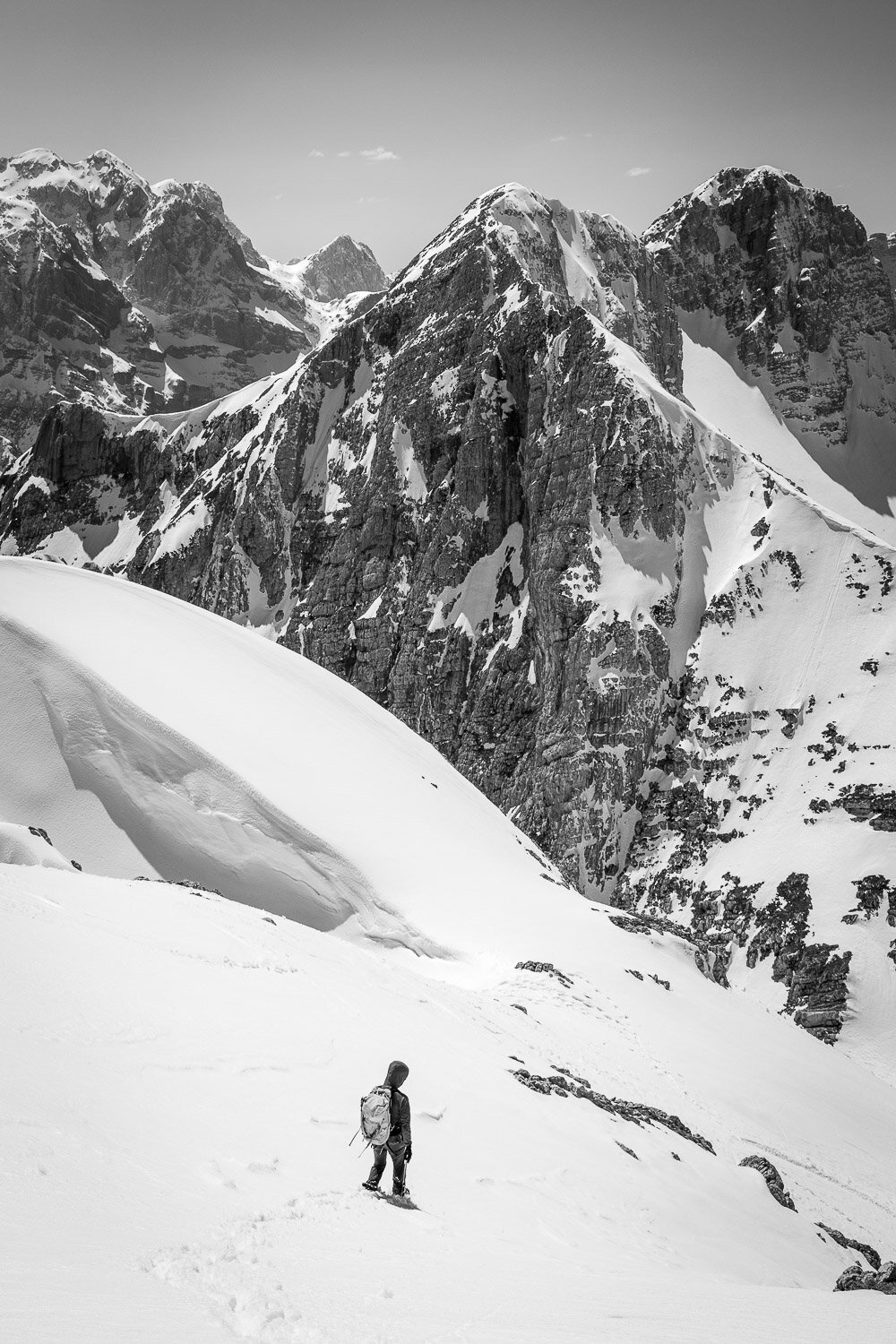 Alpine climber descending from Mt. Stenar after scaling the frozen north face.