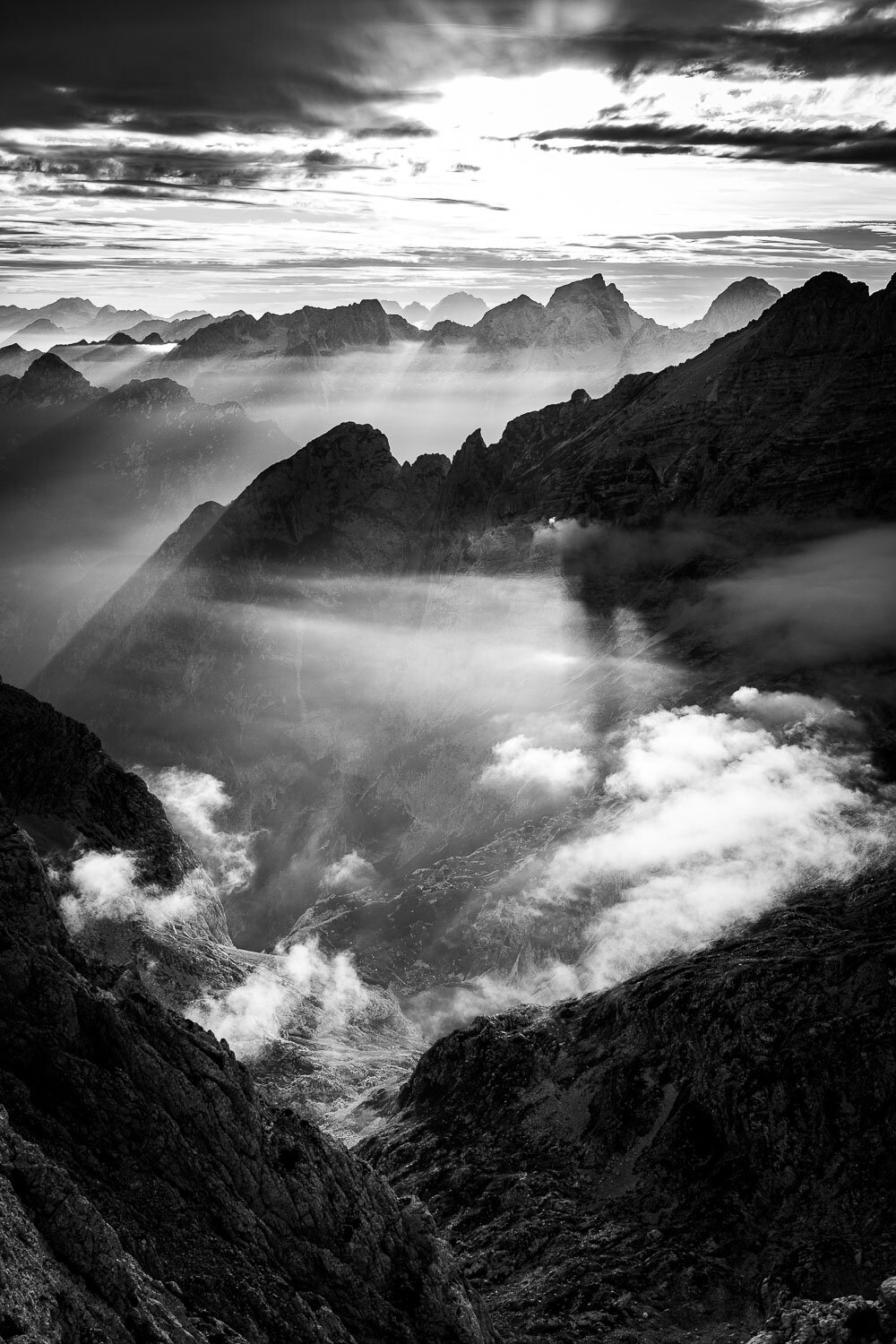 Breathtaking views on the summit of Pihavec toward the lakes of Kriški podi in the epicenter of the Triglav National Park at sunset.