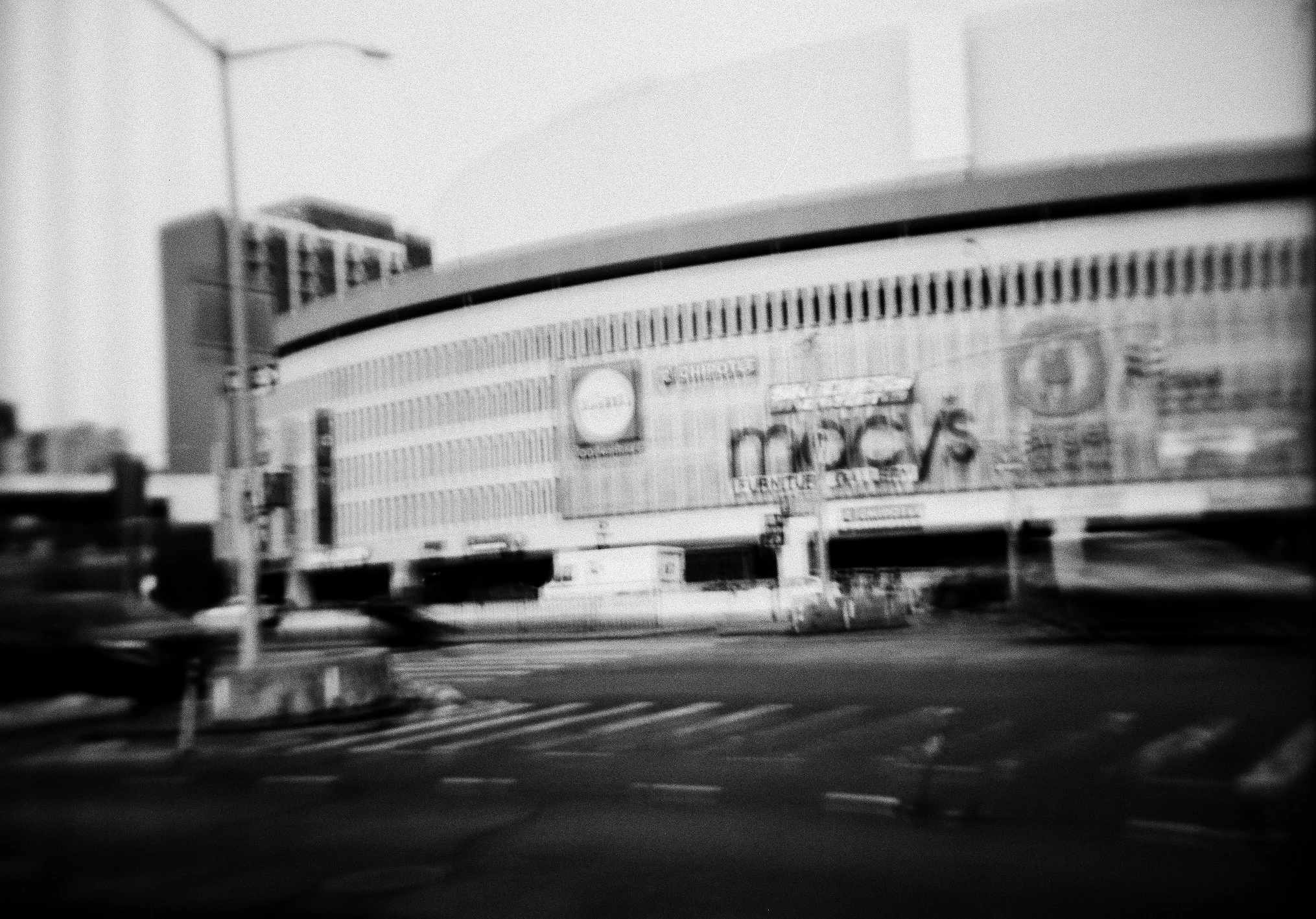   the queens place mall as seen from queens boulevard. the architecture of the surrounding block was inspired by the world’s fair held about a mile-and-a-half away in nineteen sixty-four  