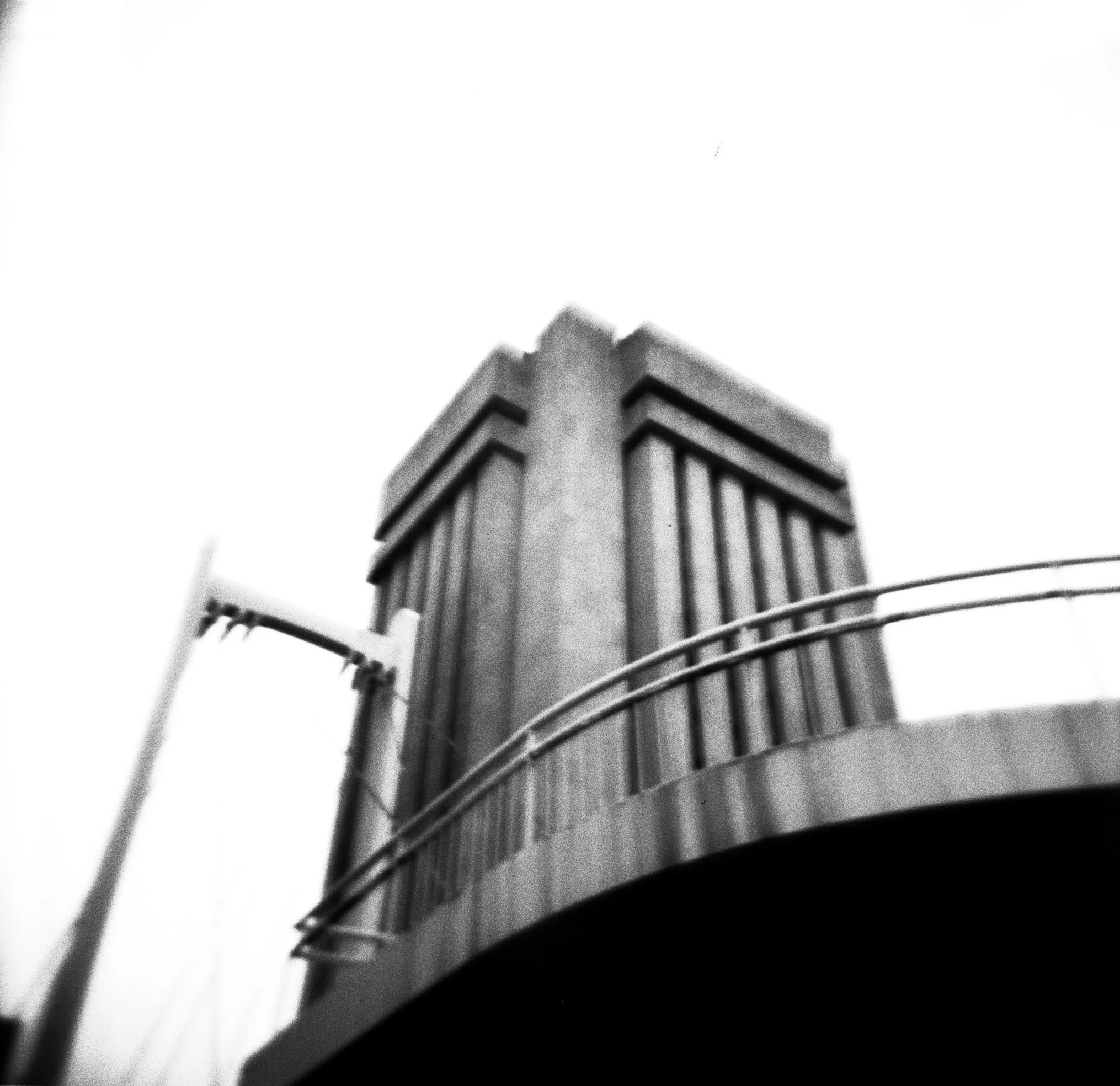   a wider angle of the weiss research building featuring its adjacent pedestrian footbridge  