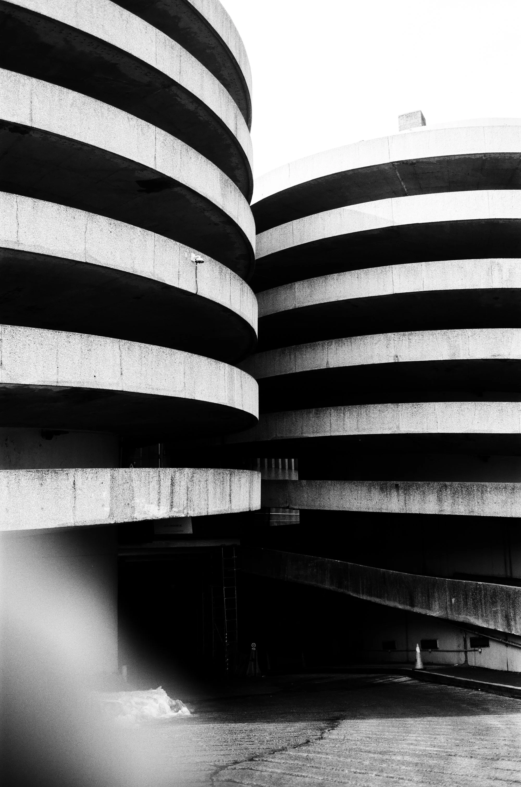   the two entry/exit ramps located at the rear of the queens place mall. their spiral shape helps continue the mall’s circular flow  