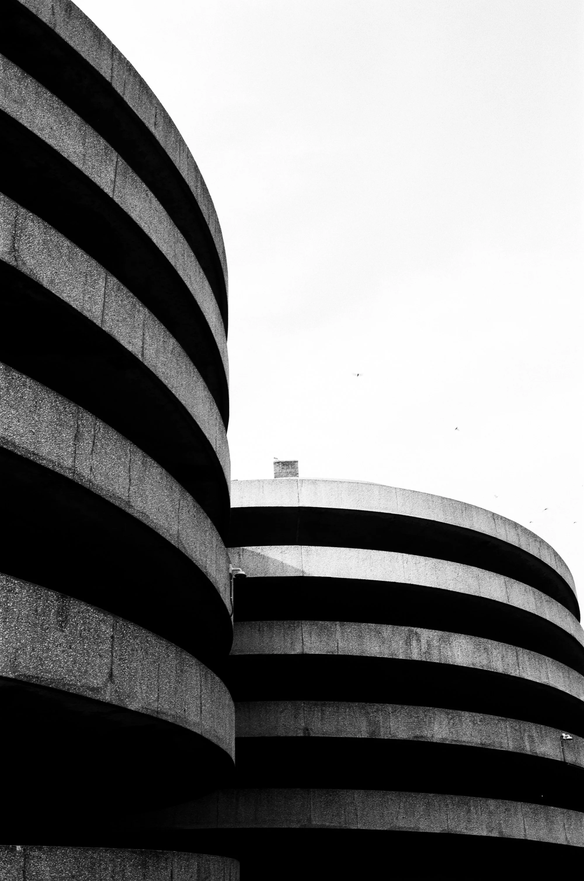   the two entry/exit ramps located at the rear of the queens place mall. their spiral shape helps continue the mall’s circular flow  