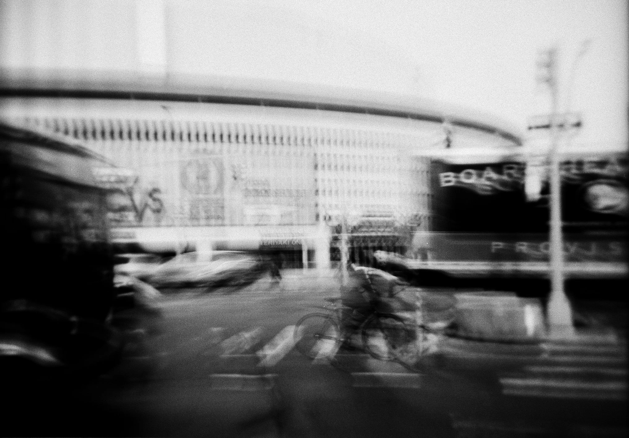 queens place mall as seen through the hustle and bustle of queens boulevard in elmhurst