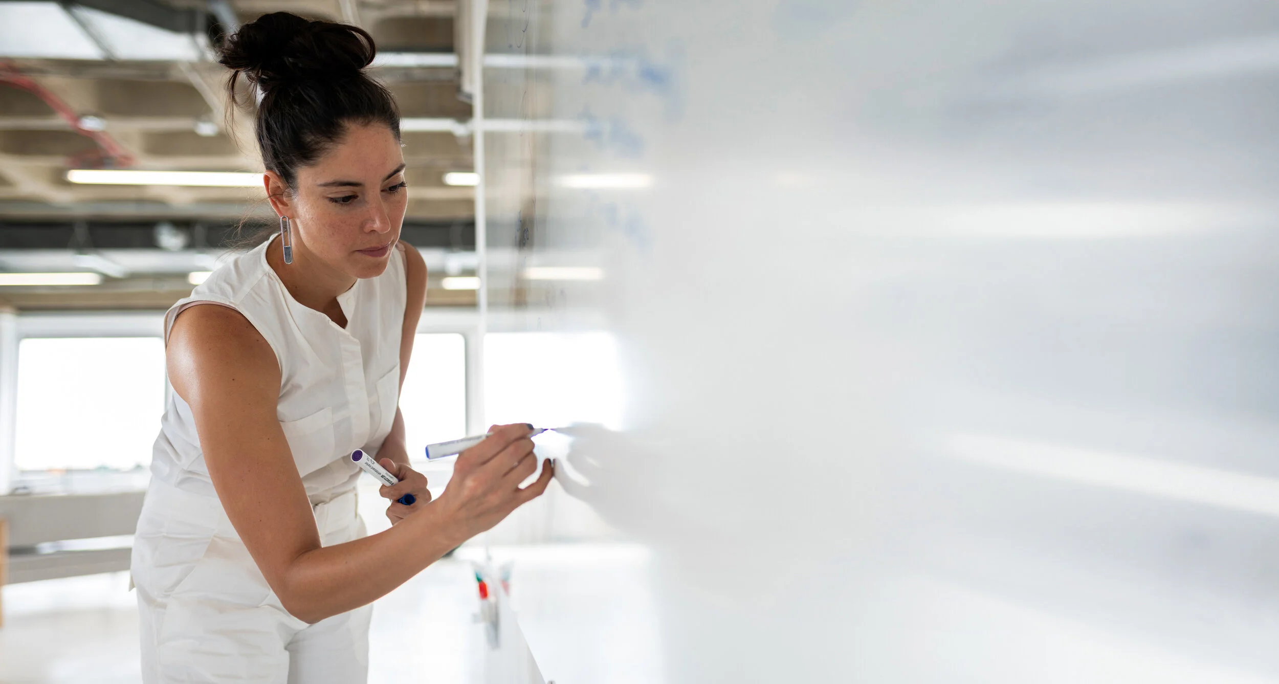 InvisiblePartners-Business_Woman_Whiteboard.jpg