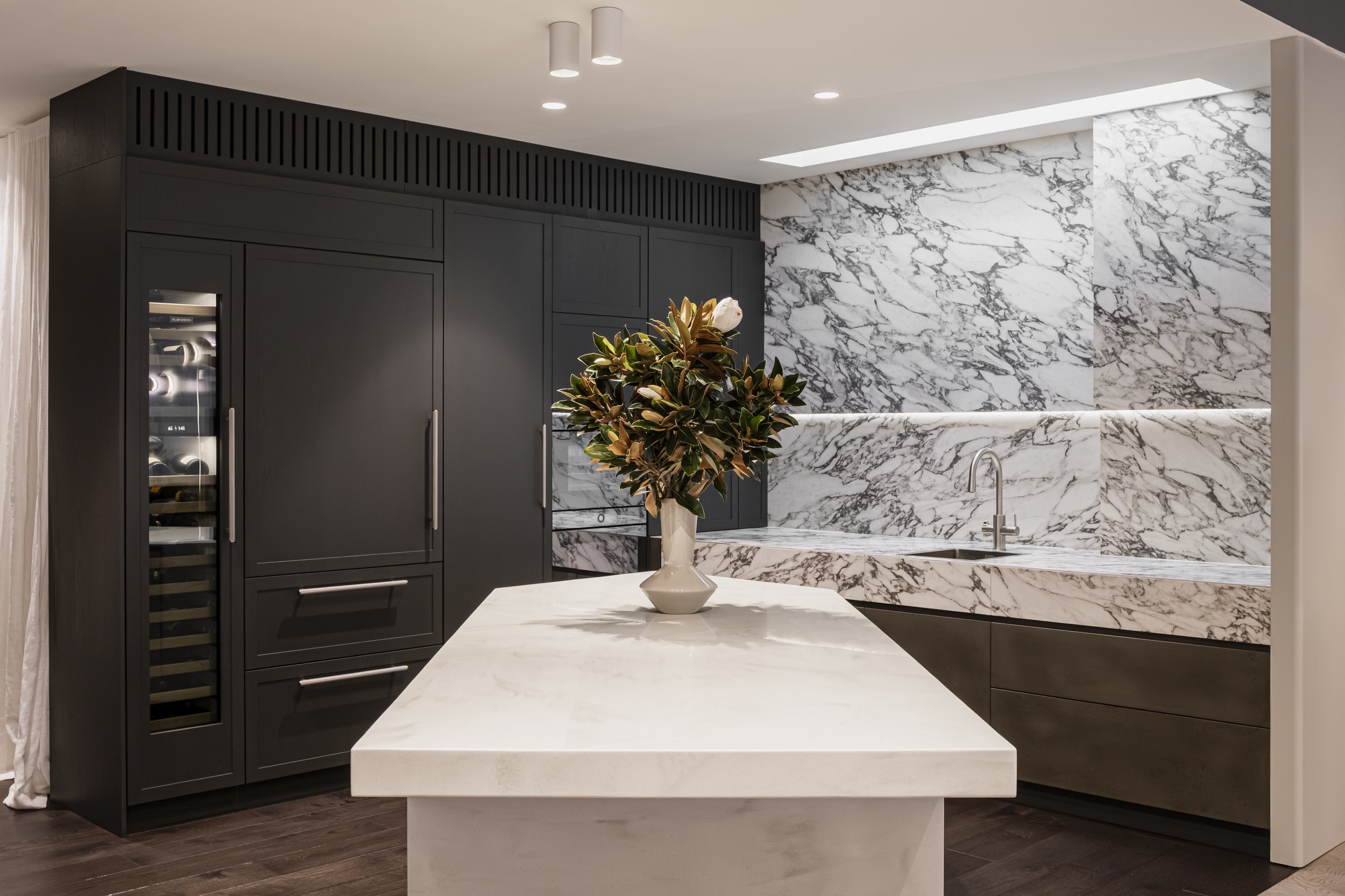 Our working kitchen, integrated appliances, hidden storage and loads of functionality at its core. Shows how much living we can put into a small space.