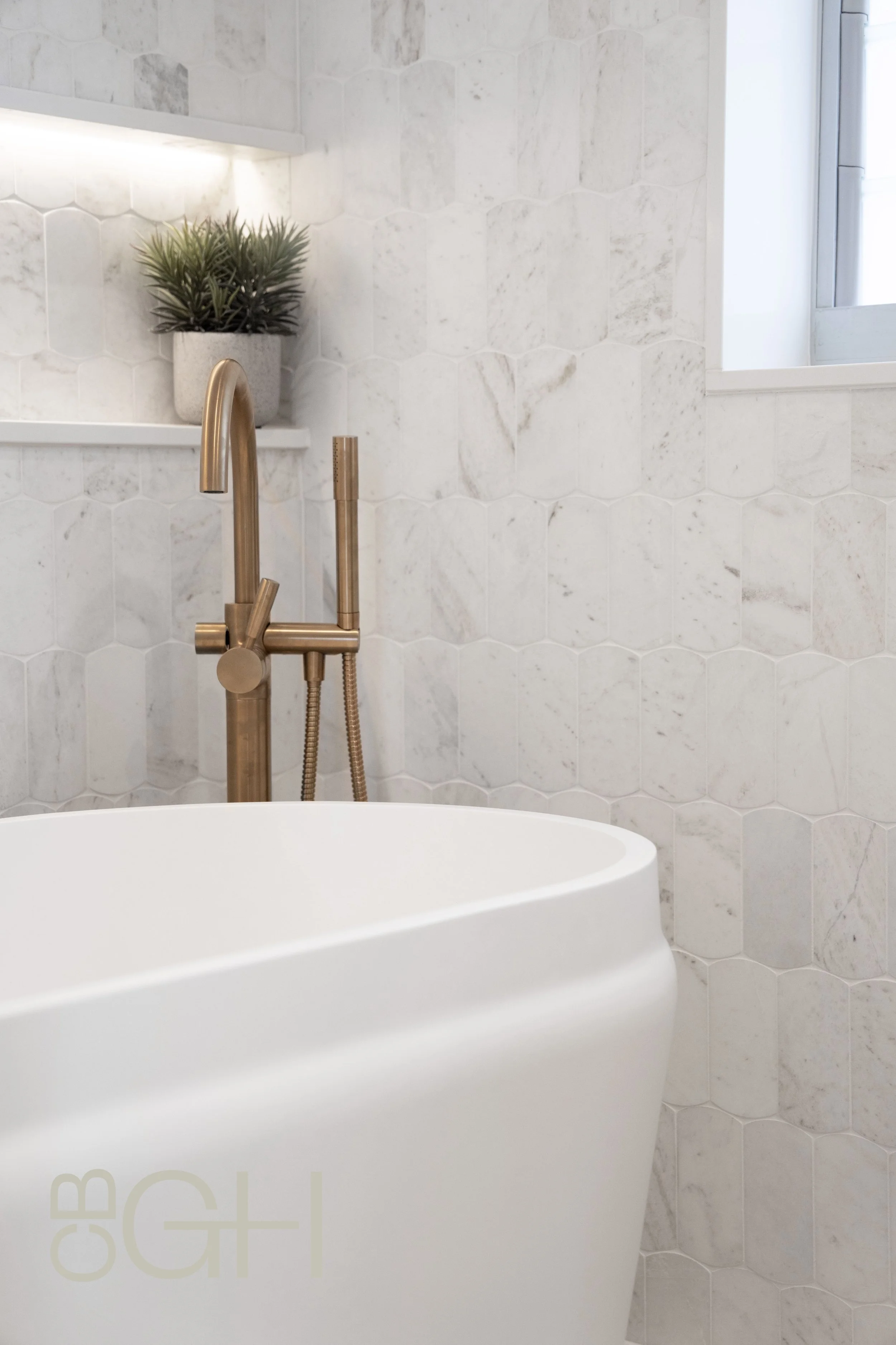 A freestanding bath and Australian made brass tapware. 