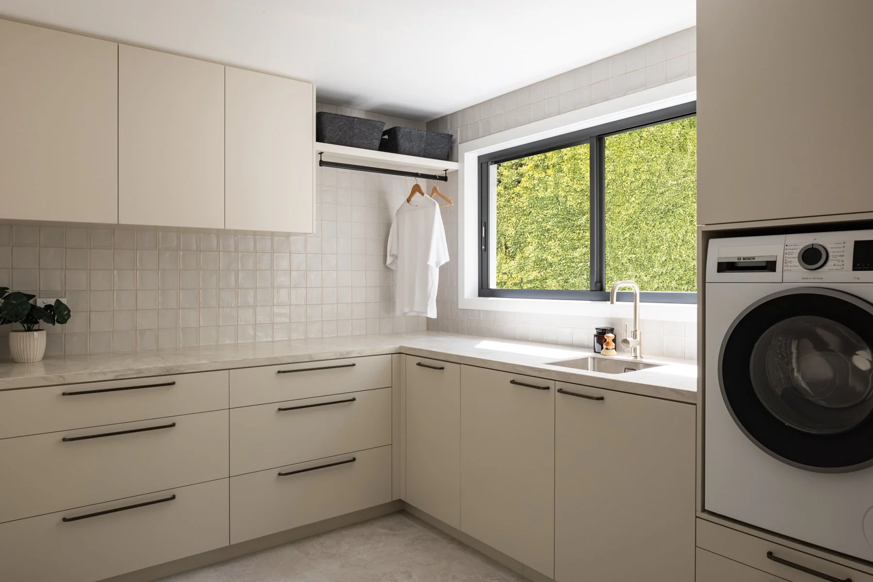 A laundry full of storage and high on functionality 