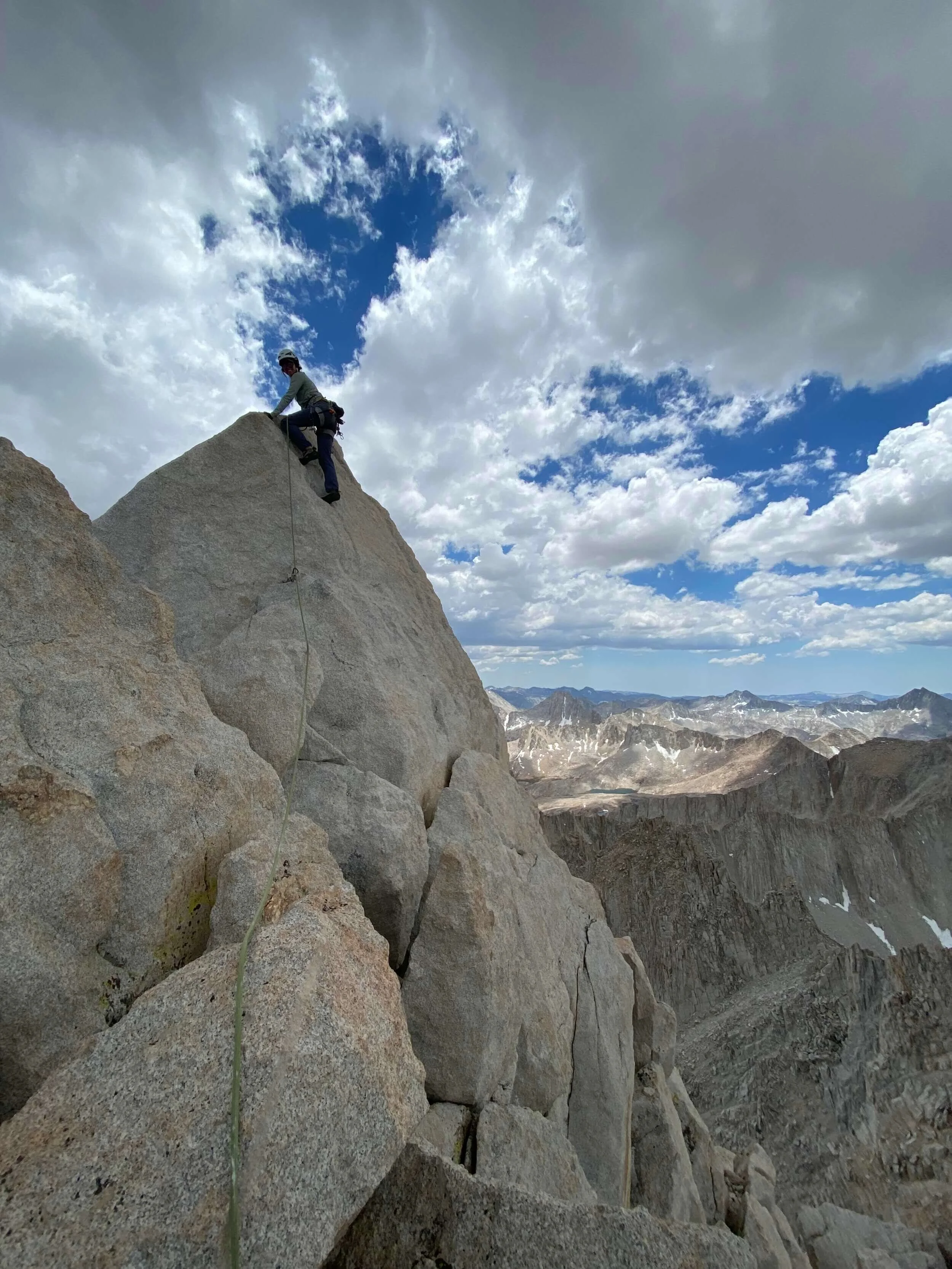 woman climbing mountain