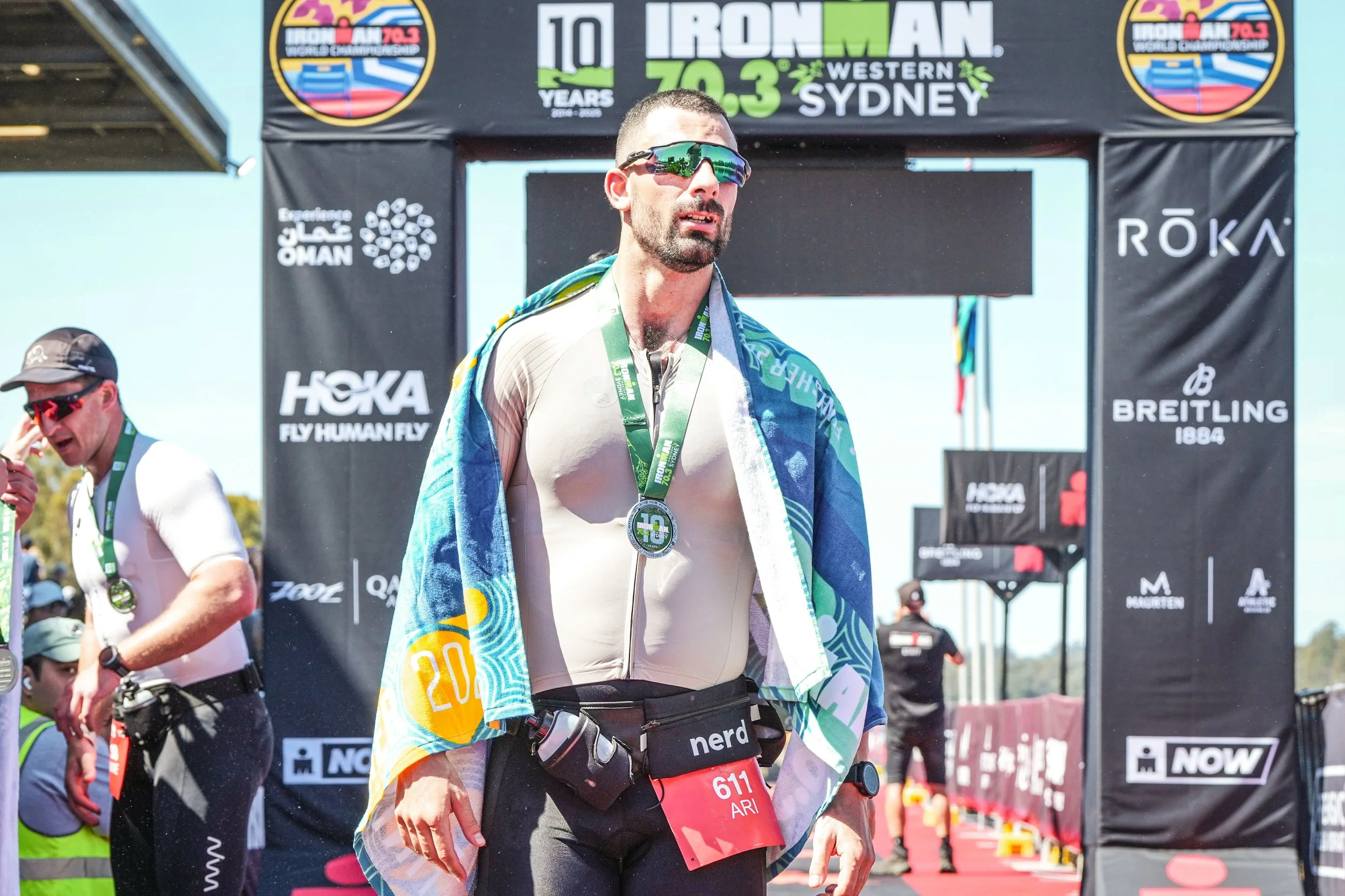 Ari Moushis PHYZFIT physiotherapist competing in Ironman triathlon