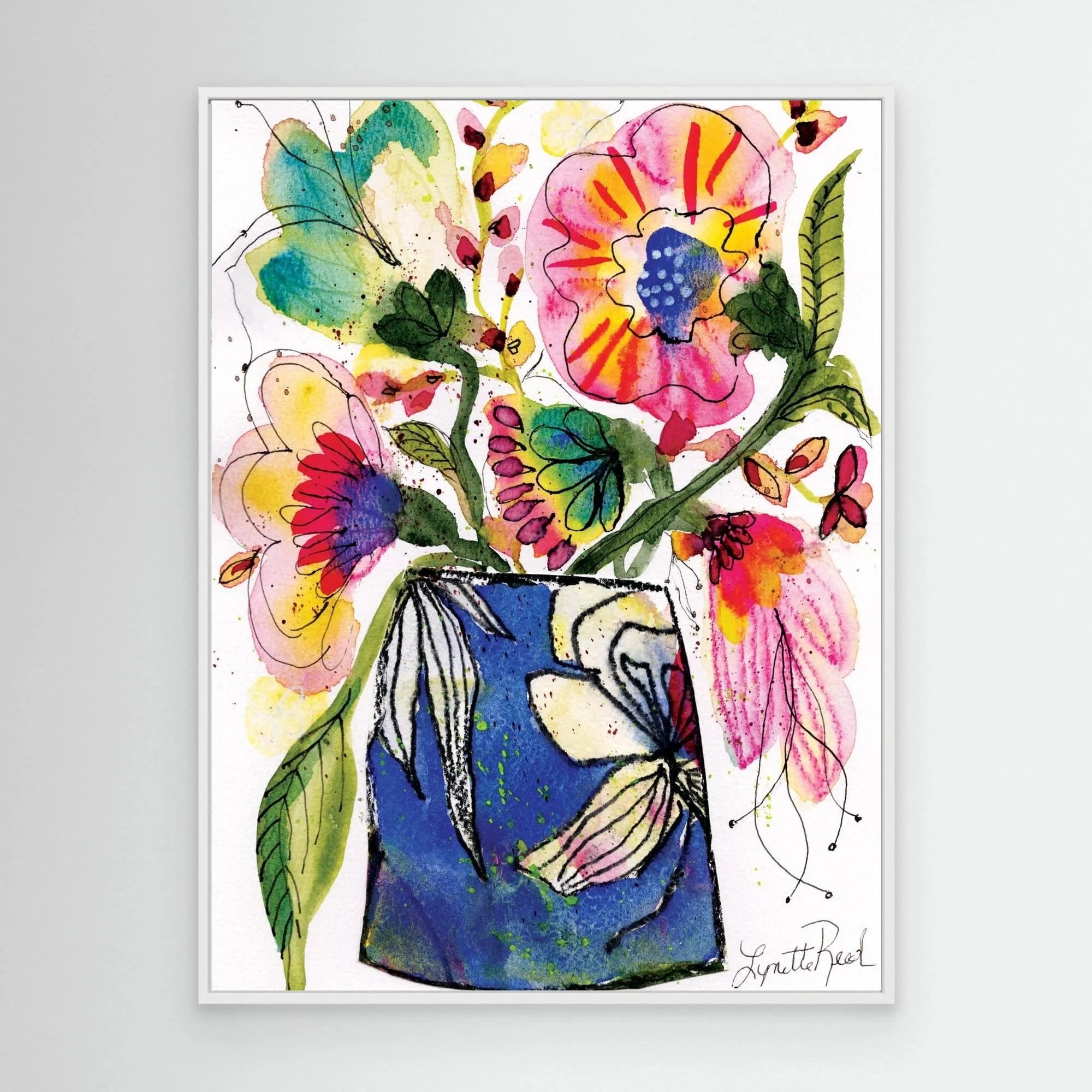 Blue Vase with Pink and Yellow Blooms canvas art print by Lynette Reed shown framed in a room setting