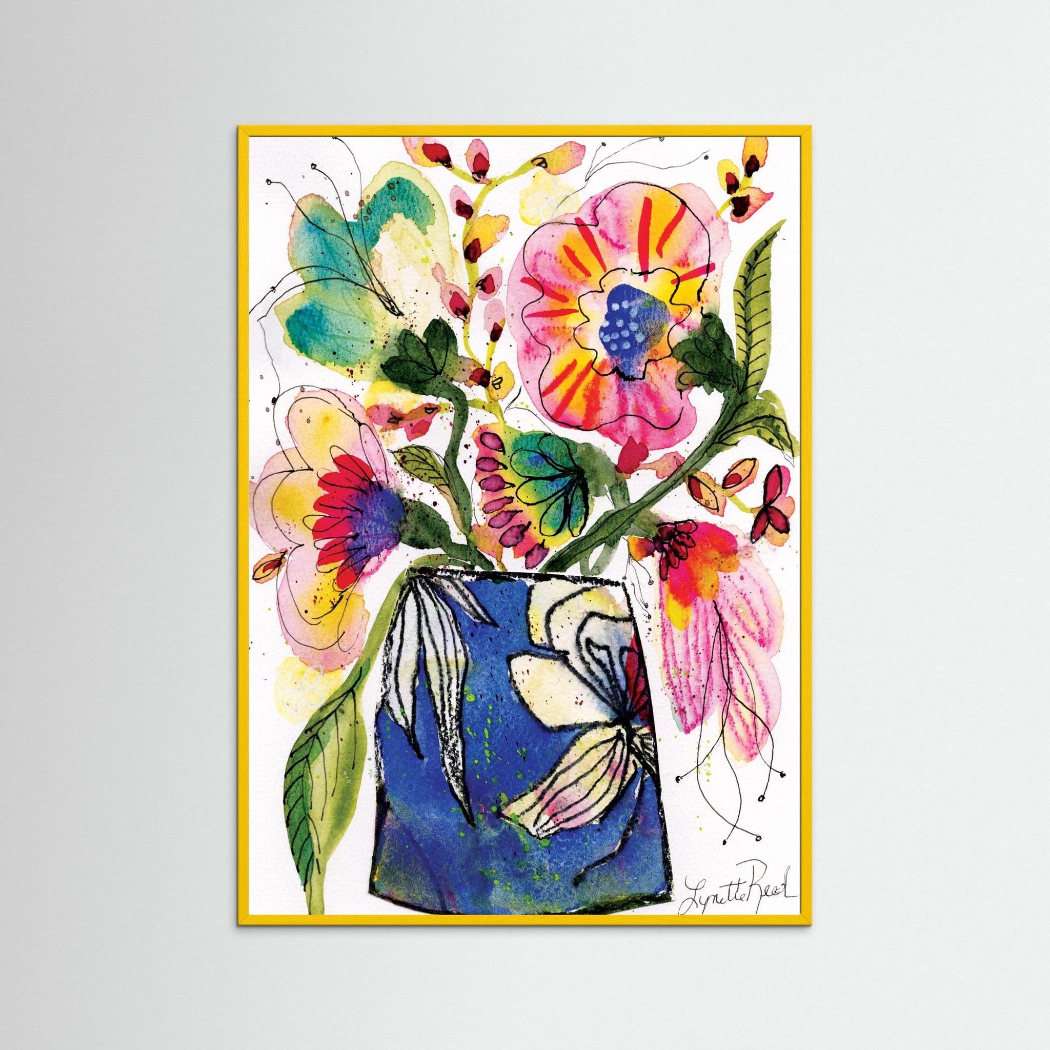 Blue Vase with Pink and Yellow Blooms art print on paper by Lynette Reed shown framed in a room setting