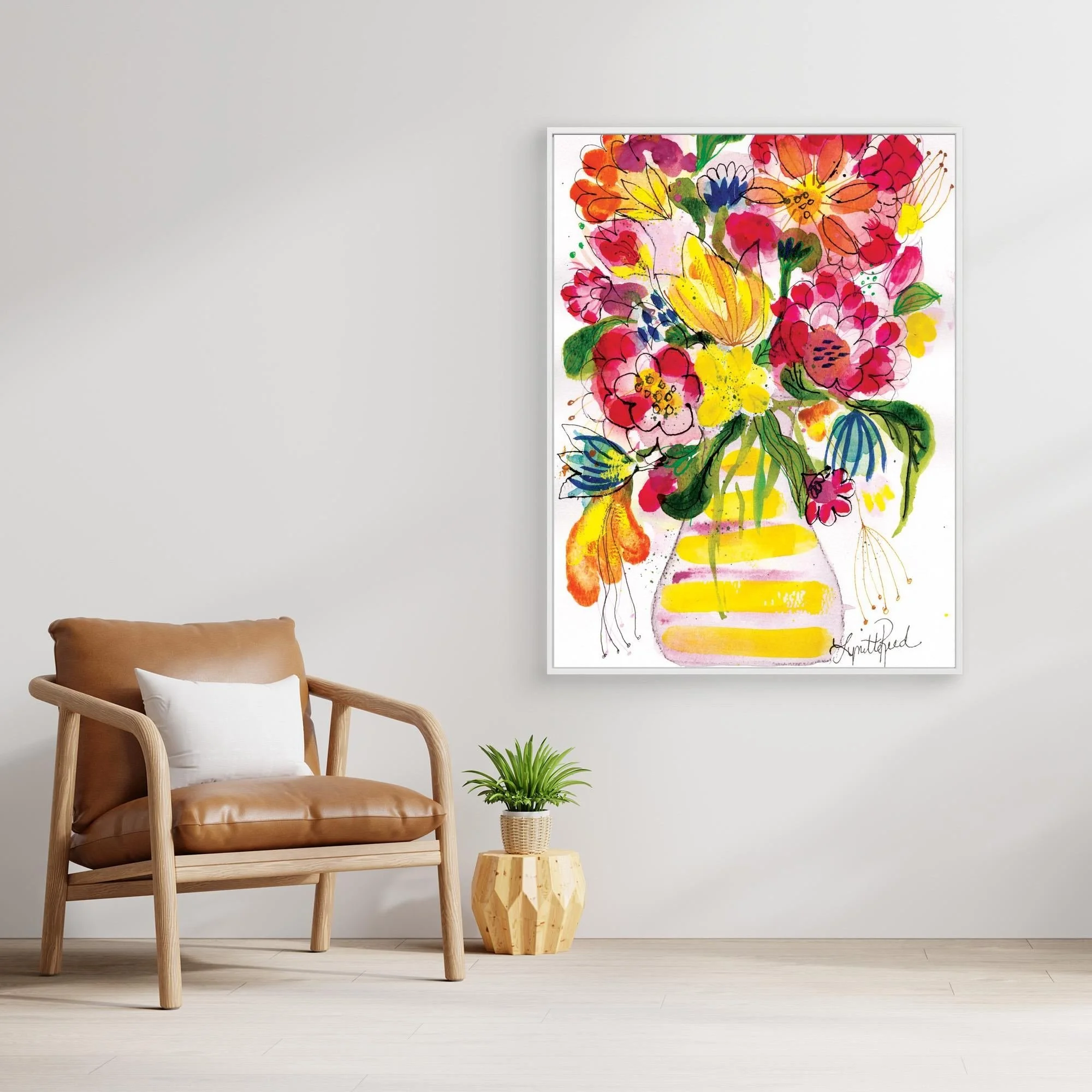 Yellow Striped Vase With Bright Blooms canvas art print by Lynette Reed shown framed in a room setting