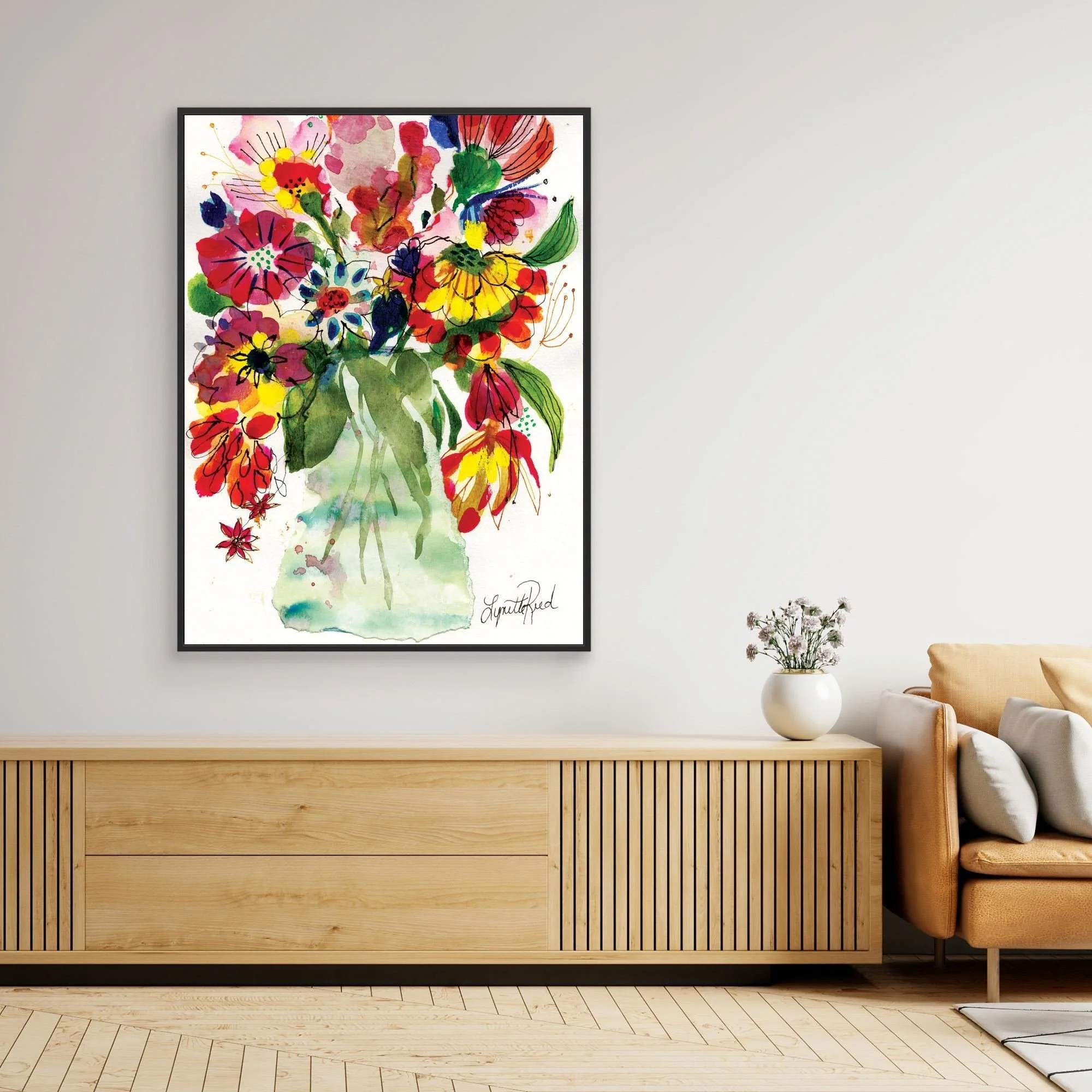 Green Glass Vase with Wild Blooms canvas art print by Lynette Reed shown framed in a room setting