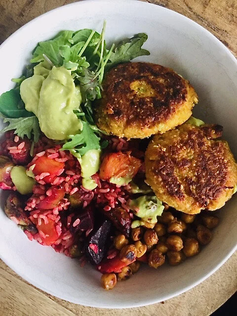 Bowl of Sweet potato quinoa cakes with avocado lime dressing