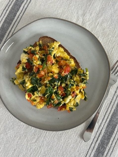 Plate of Scrambled Eggs with Veggies and Whole Wheat Toast