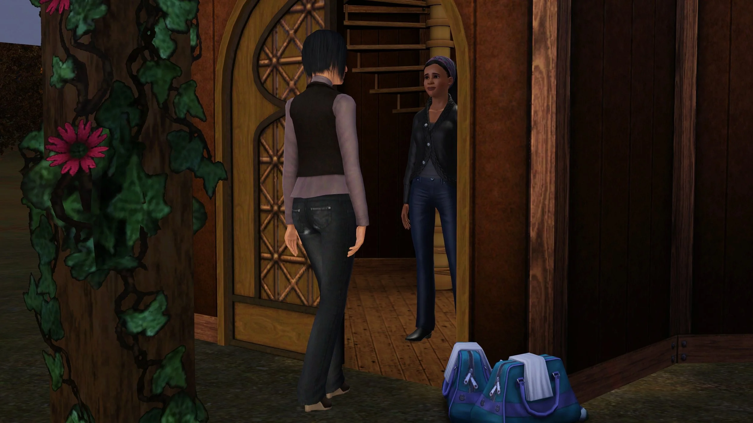 Colette steps toward an open ornately-patterned door, Emery stands inside with a small sad smile. Two duffel bags are on the ground next to the door and a flowering vine-covered pillar is in the foreground; lighting suggests it’s evening.