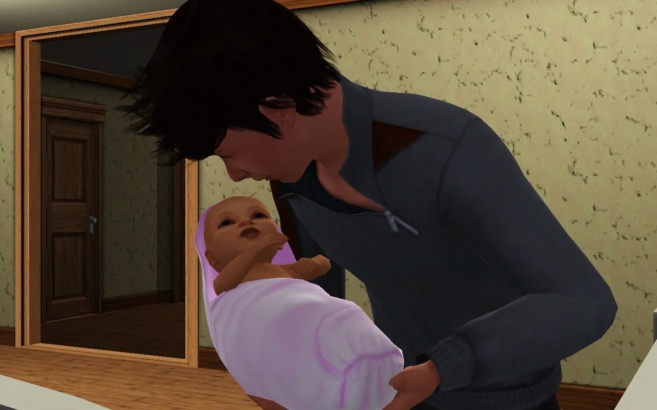 Close-up of Matthew looking into baby Mara’s eyes as he gently lowers her into her crib; she looks up at him with one hand slightly outstretched towards him.