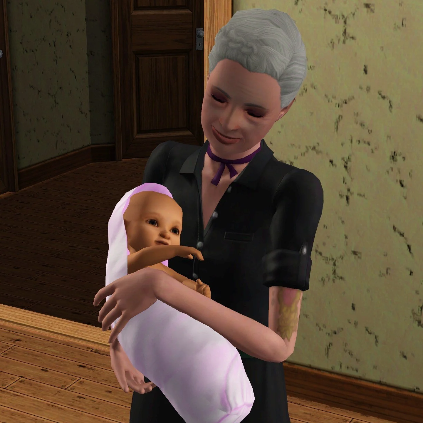 Bridget looks down or has her eyes closed as she holds baby Mara near her stomach and chest. Bridget wears a black dress and her skin is slightly more pale than Mara’s; Mara has dark eyes and is swaddled in a pale pink blanket.