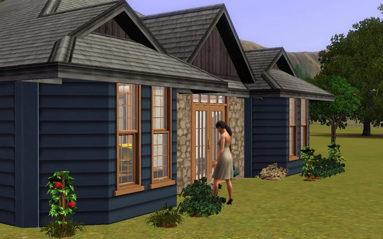 Dorothy watering plants in front of the single-storey Button Ranch home, wearing her maternity dress.