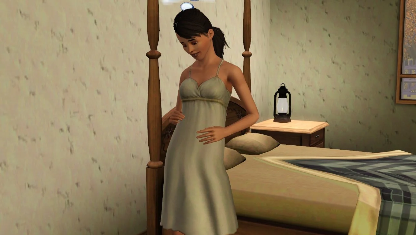 Dorothy looks down at and tenderly touches her mostly flat stomach with both hands, wearing a beige maternity dress, standing at the side of her unmade bed. Her black hair is styled with side bangs and a bushy low ponytail.
