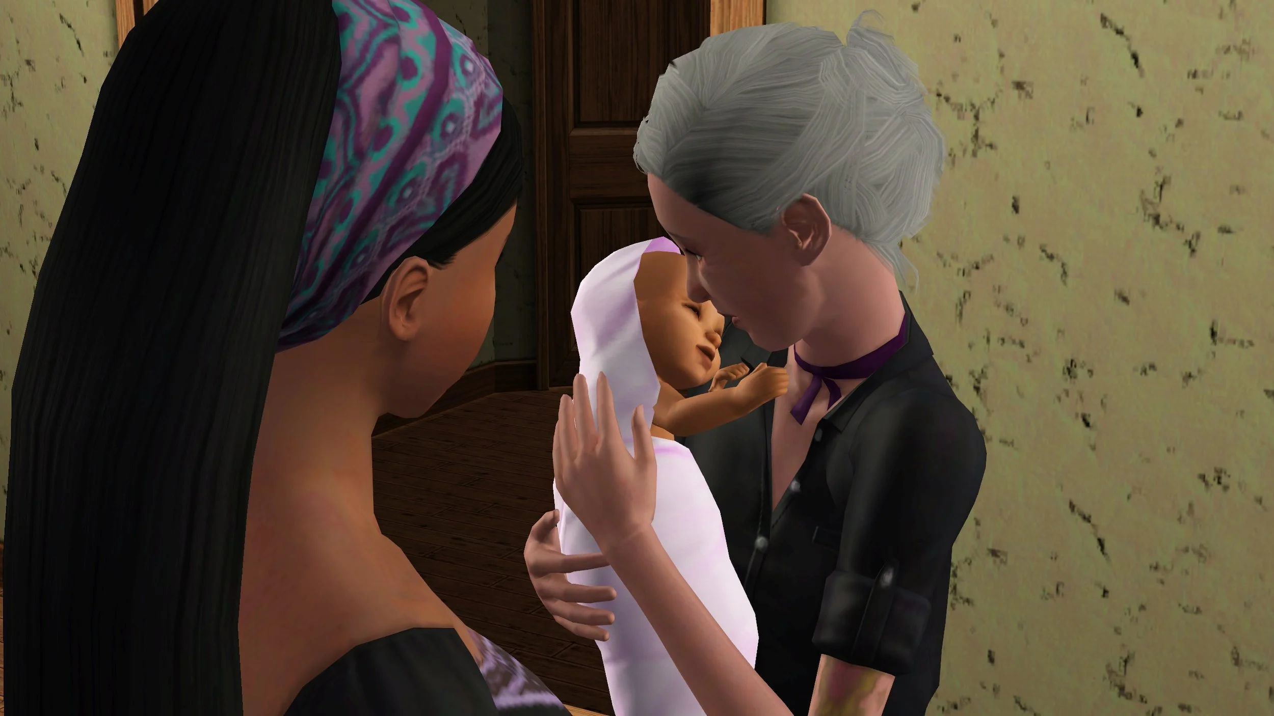 Bridget holds Mara very close, the baby’s head and tiny arms on her shoulder; Bridget’s nose nearly touching Mara’s forehead. Viewed from over Emery’s shoulder, Emery stands in front of them.