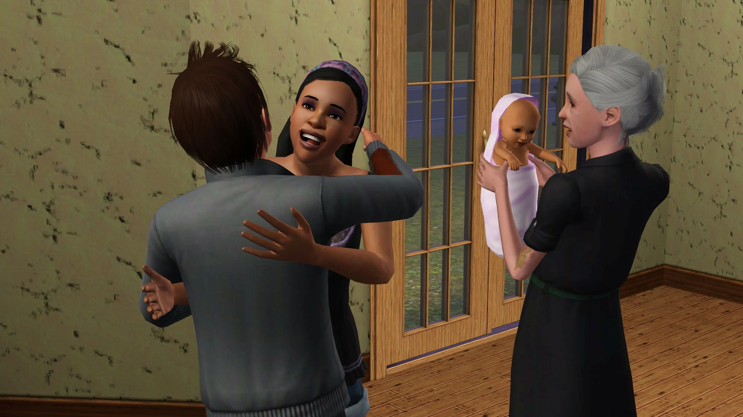 Emery has a big bright smile as she leans in to hug her brother Matthew; they’re standing next to their elderly mother Bridget holding baby Mara, near the front door of Matthew’s home.