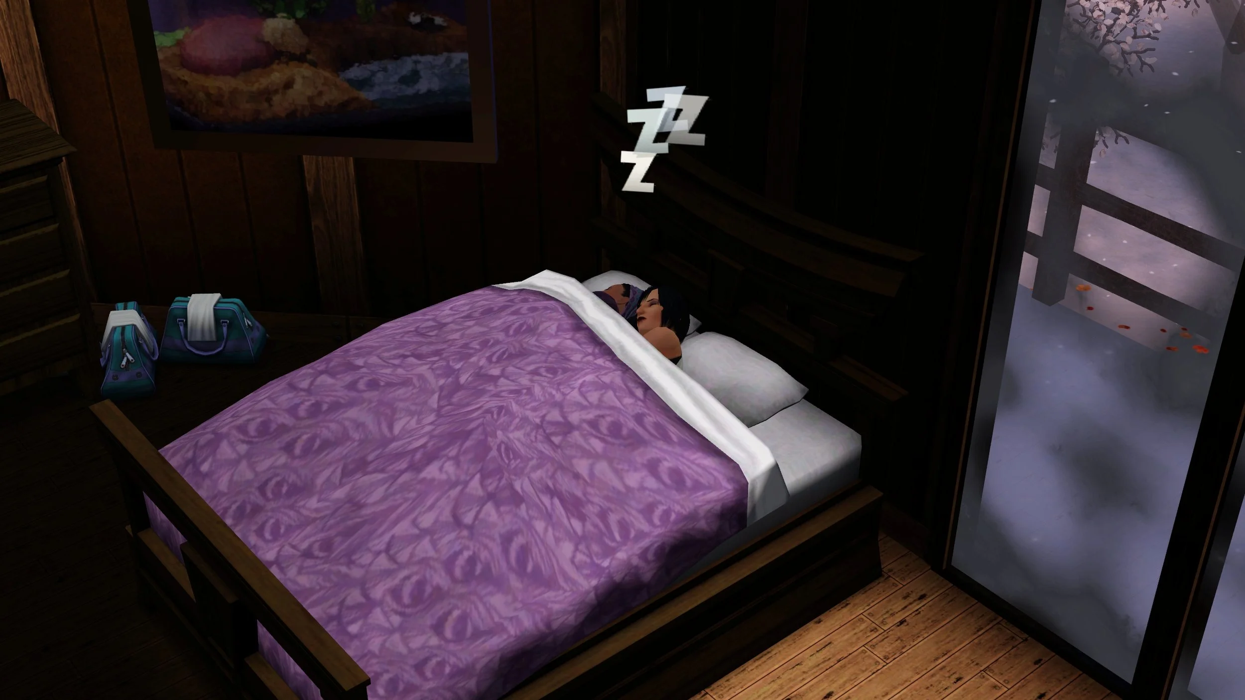 On opposite sides of the bed from where they were in previous photos, Emery is being cuddled by Colette under the bed covers, with z’s above their heads. Next to the far side of the bed are two duffel bags on the floor.