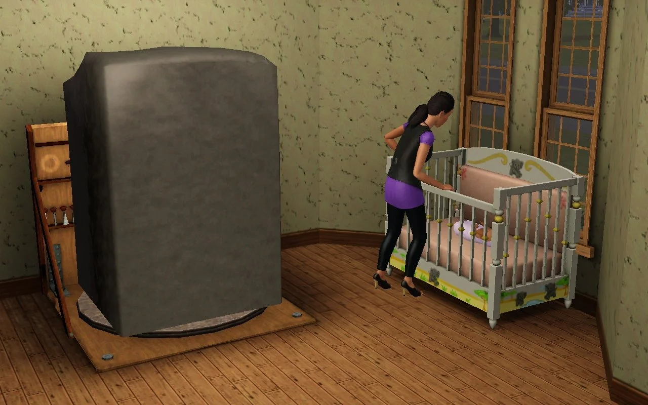 Dorothy stands over baby Mara in her crib with her hands on the rail. Behind her, a large block of material sits on her sculpting station, mostly intact.