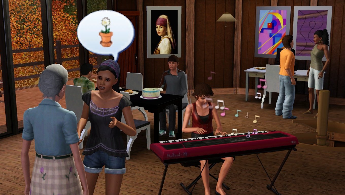 Emery talks to Bridget about a potted flower; Aria plays her keyboard near the middle of the room. Matthew and Mason sit at a dining table where there is an untouched birthday cake and loaf of bread. Ryker talks to Rukiya near Emery’s desk.