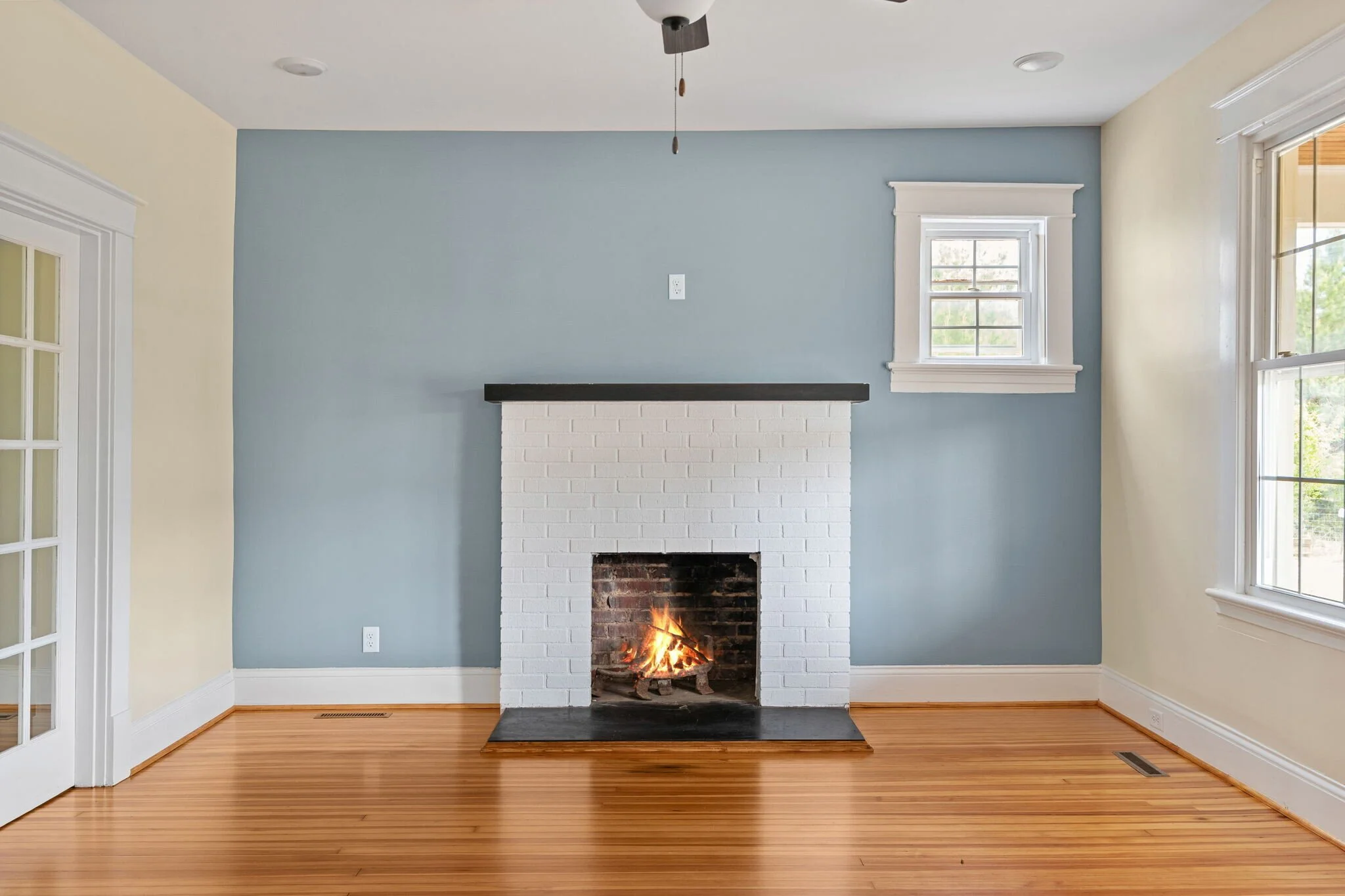 A classic farmhouse with a touch of modern charm, this living room got a thoughtful refresh. One standout update? The original heart pine flooring.

Because it was in relatively good condition, we were able to protect it during construction and repla