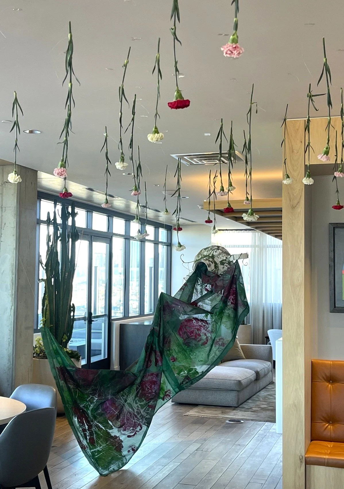 The Equinox Door 6 ft x 18 ft x 5 ft plaster, wire, florals, paper, silk fabric, ink, and acrylic Edit River North Denver, CO 2026