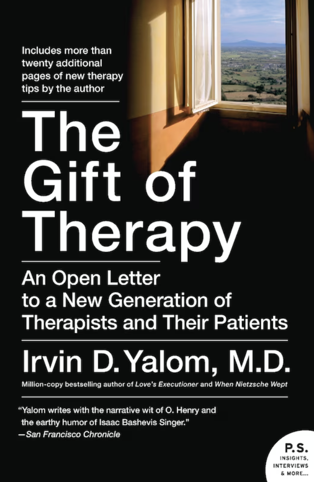Book cover for "The Gift of Therapy" by Irvin D. Yalom, featuring an open window with a scenic landscape view and sunlight casting shadows on a wall.