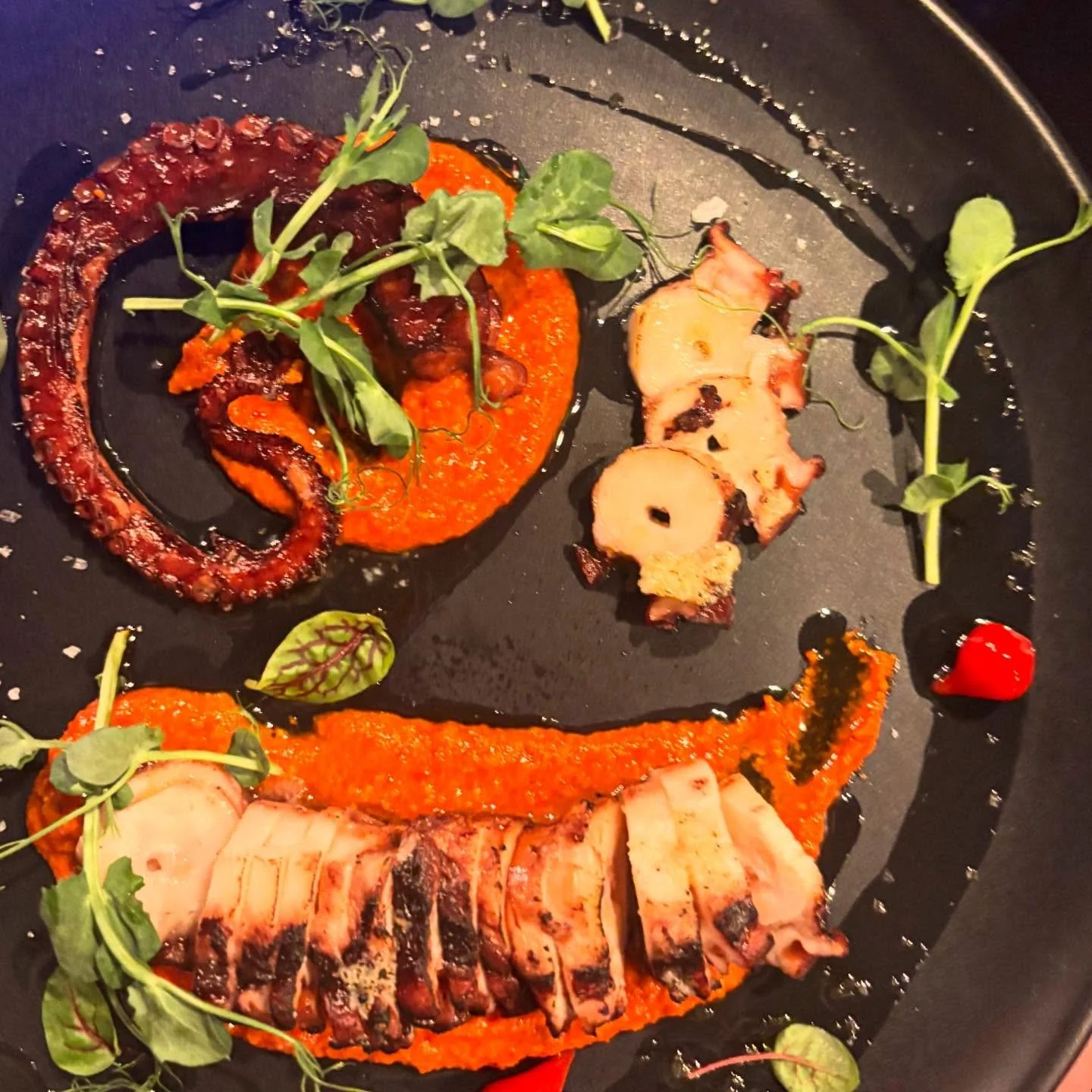 Veerle with her Pulpo con Salsa Romesco looking like a work of art 💃🏻 
West Coast Wild Caught Octopus cooked Galician style and grilled with almond romesco. 

We&rsquo;re on Resy! Book your table in the link in bio 
🇪🇸🇪🇸🇪🇸
Matadora Tapas 
Aut
