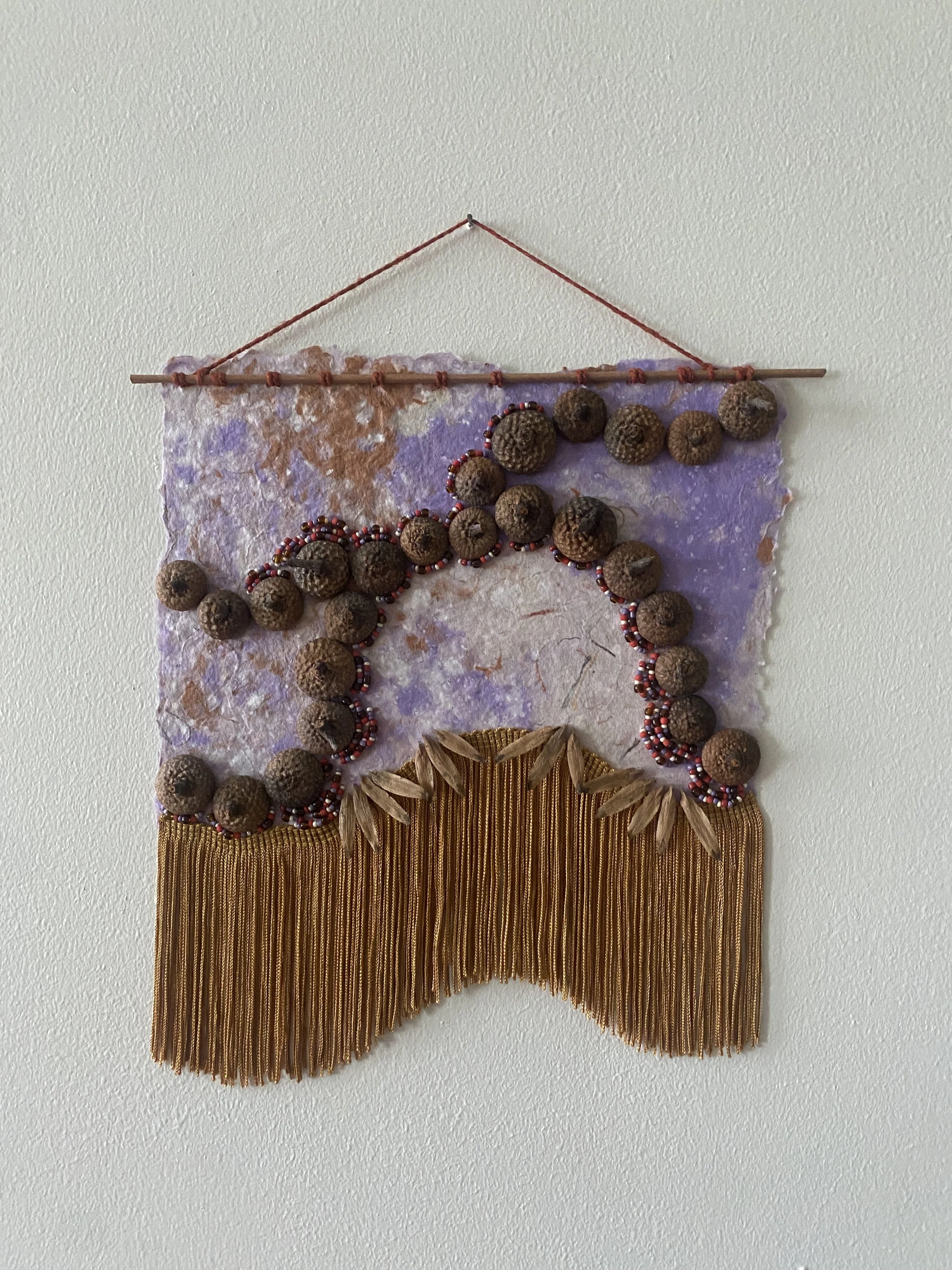 Veneration of Acorns 2 | handmade paper, acorn caps, tulip poplar seeds, decorative elements | 2025