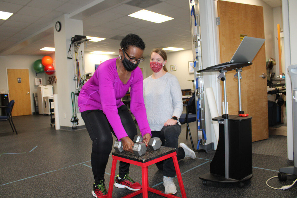 Ms Hattie lifting weights proper form with Sarah Russell, Physical Therapist at NC Center for Physical Therapy.jpg