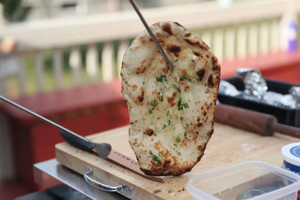 Fresh naan cooked in the live tandoor for Indian catering in Melbourne