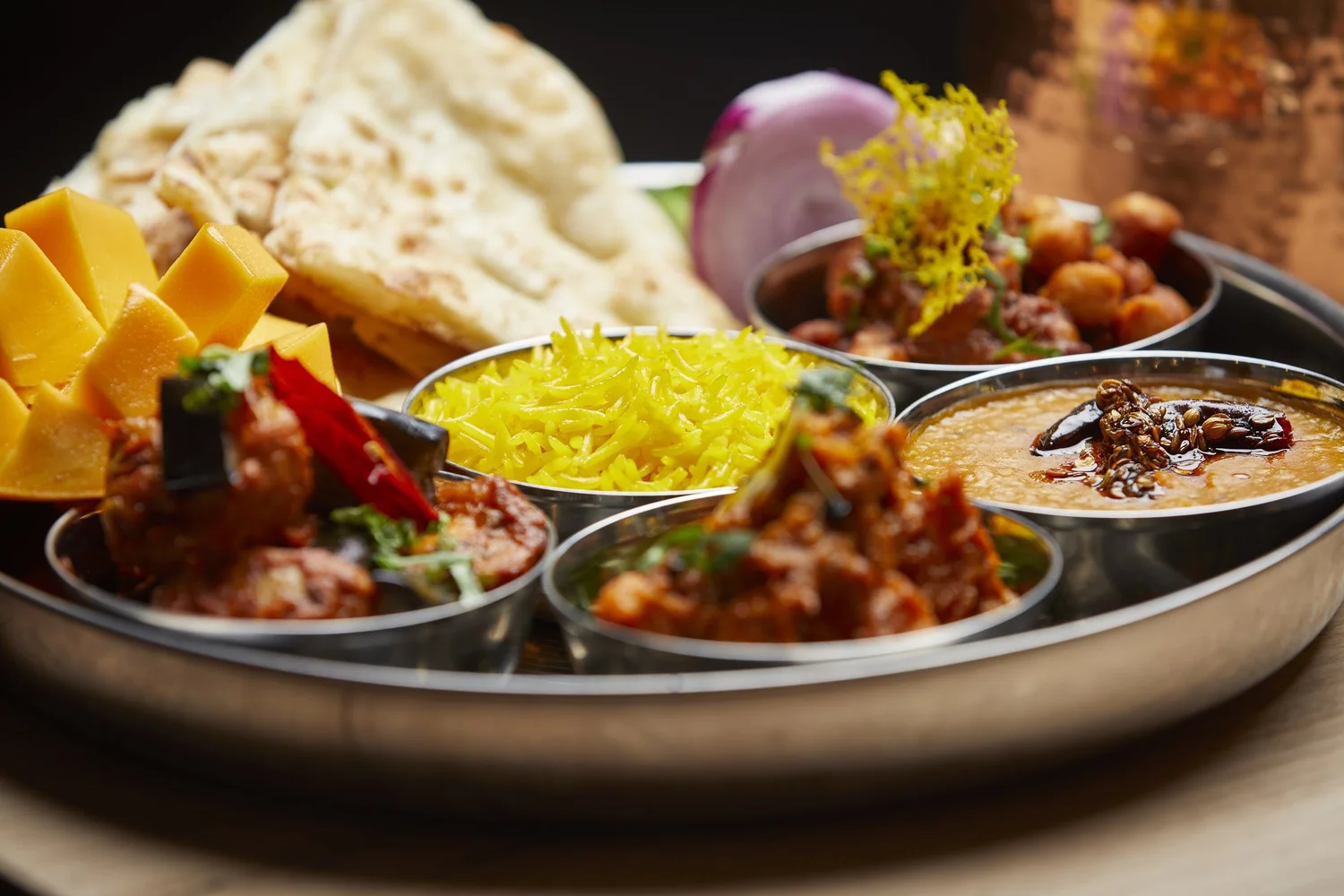 A shared spread of curries, rice and naan at Masti Fitzroy