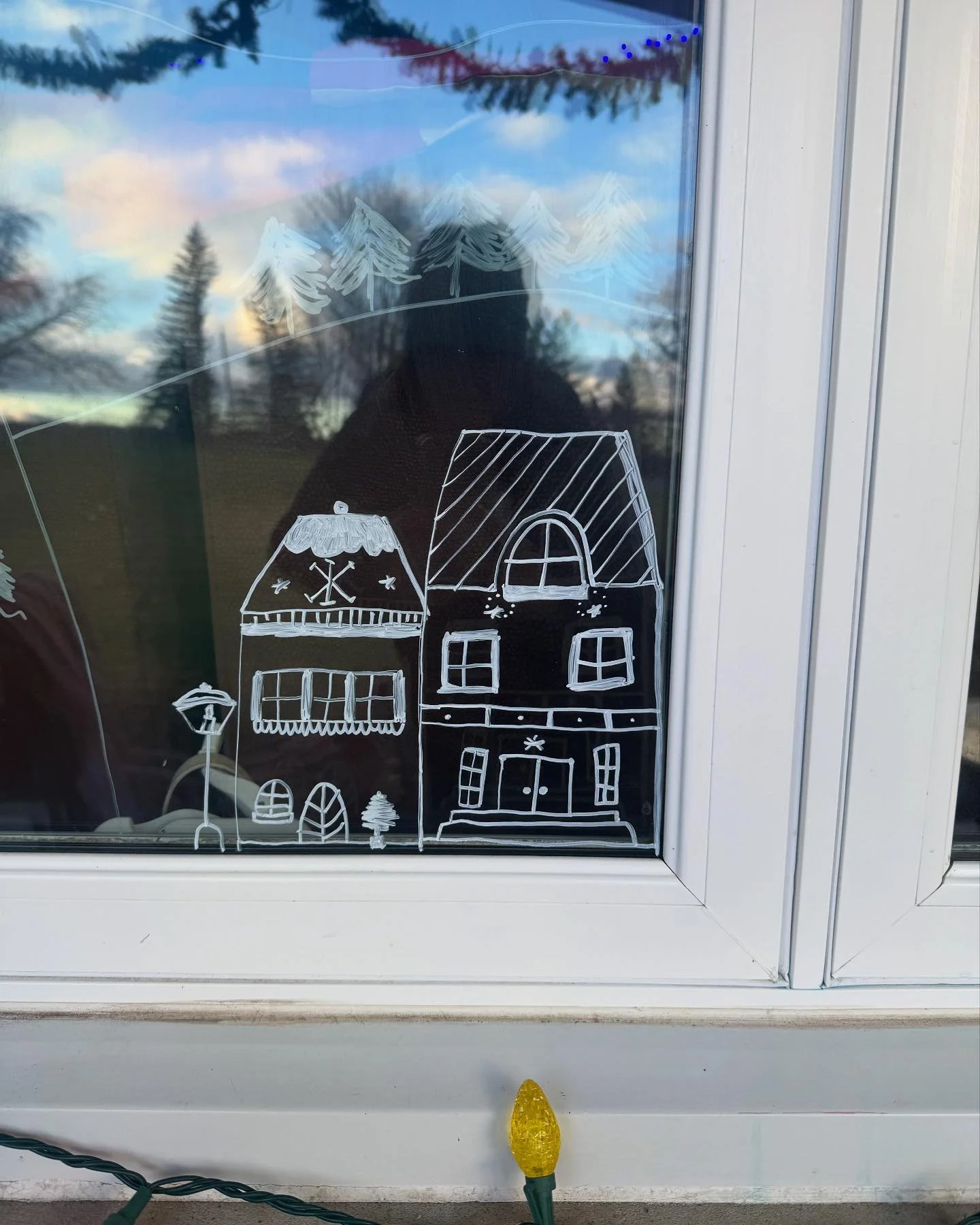 this week&rsquo;s just-because-it&rsquo;s-fun project is drawing this chalk Christmas village across the length of our living room windows.. so much more to do, but 🥹😍❄️