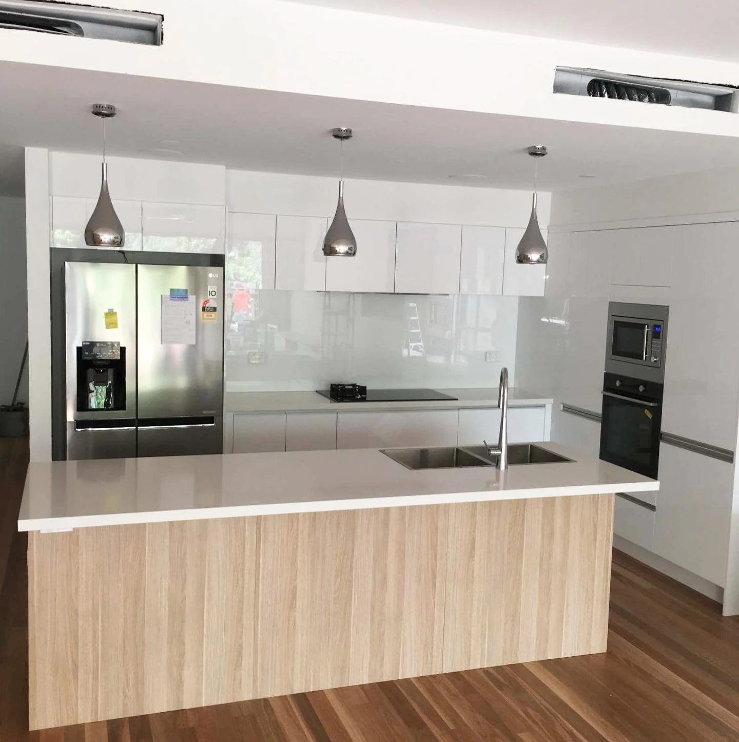Beautiful kitchen update - modern finishings and lighting. Very trendy.