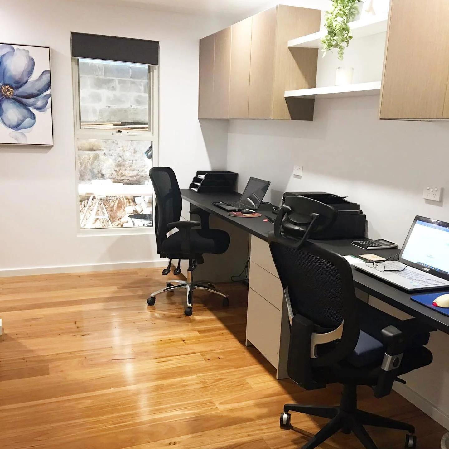 Beautiful office complete renovation in the Sutherland Shire. Working with a narrow space to create a spacious work room for two people. Beautiful rich timber flooring with royal blue accents. One of my favourites.