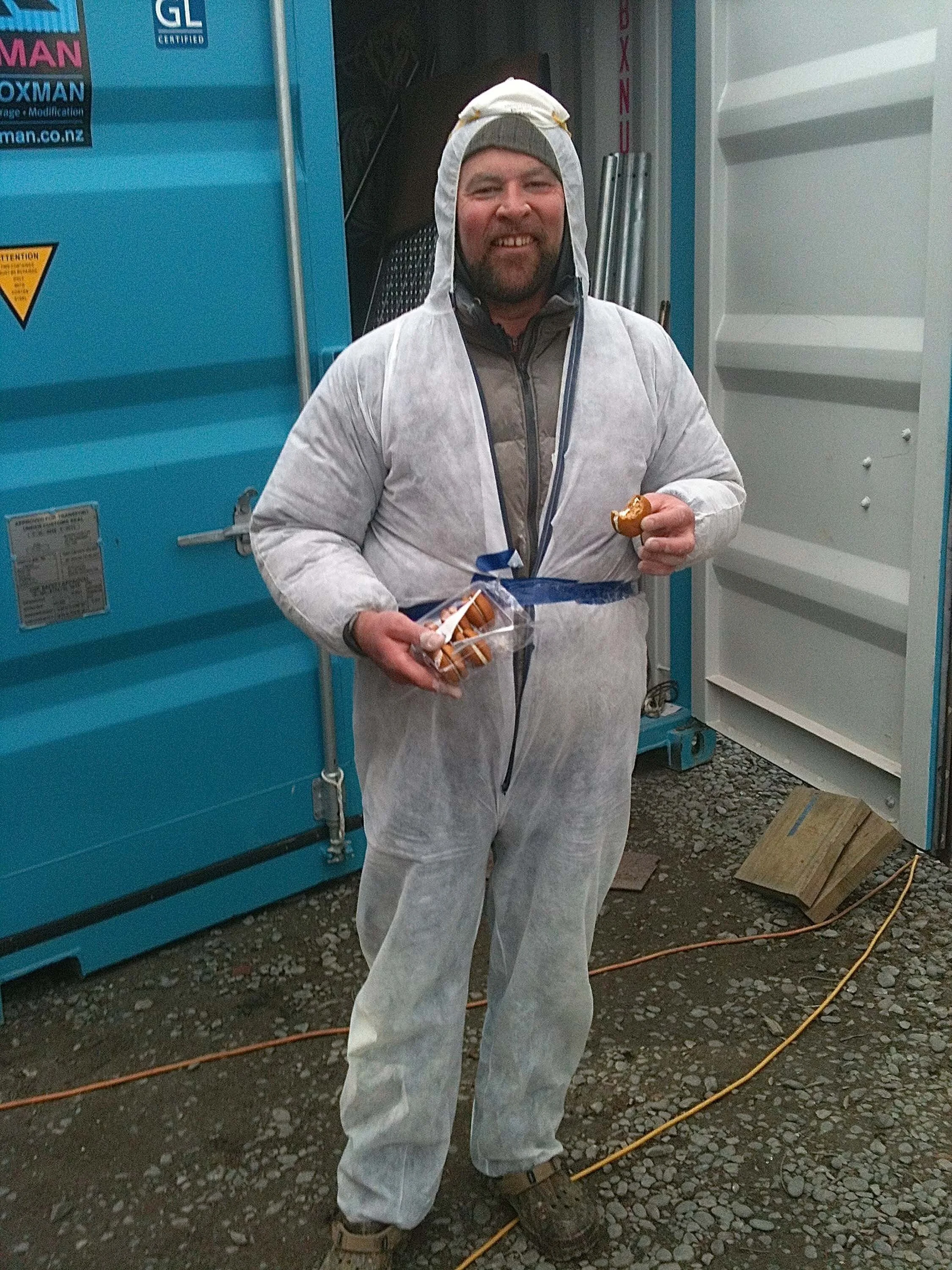 High fashion on the building site. The crew modling the bunny suit with masking tape clasp.jpg