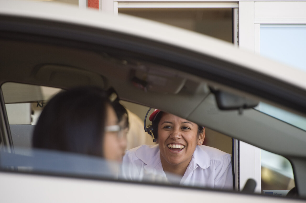 ANAHEIM, CA – Stephanie Rodriguez works the In-N-Out pick-up window at the California company's 300th location, at Ball Road and State College Boulevard, shortly after the grand opening in Anaheim on January 7, 2015. (Joshua Sudock)