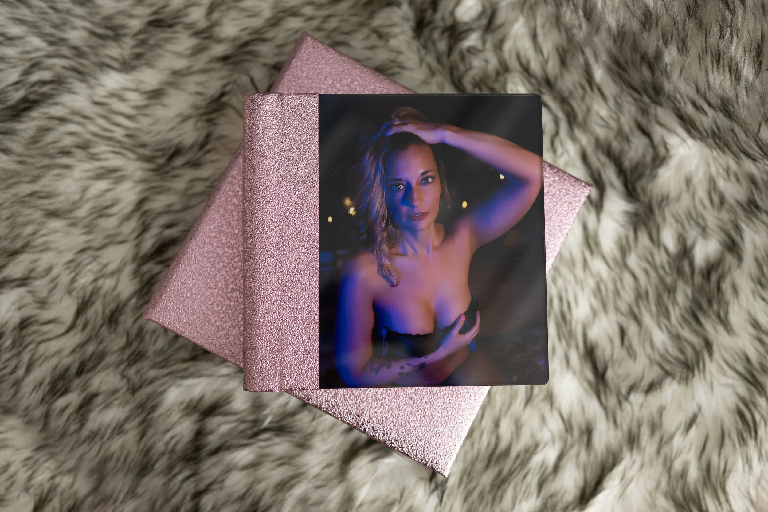 boudoir album laying on rug
