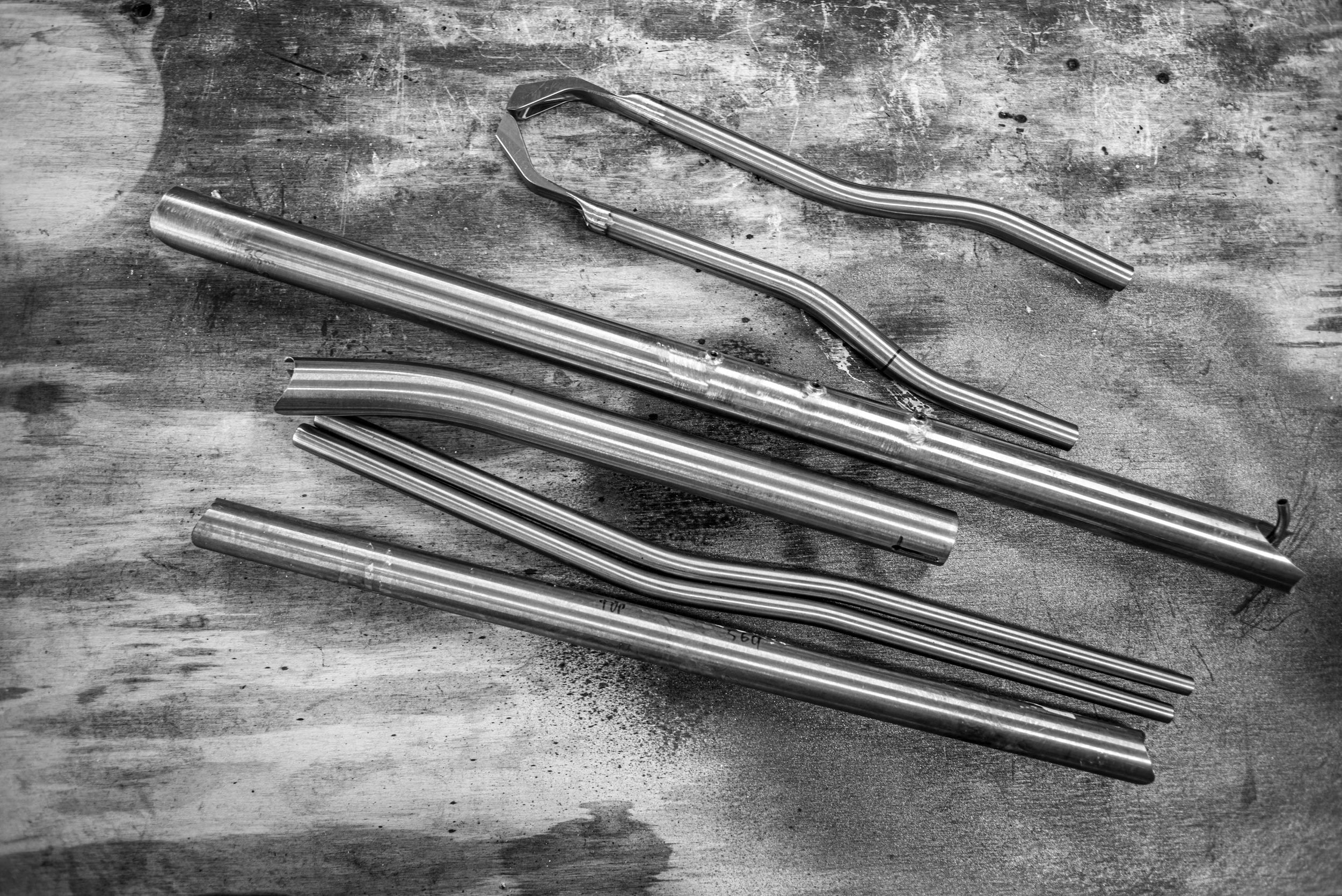 Steel bent, mitered, bosses brazed in, ready to weld